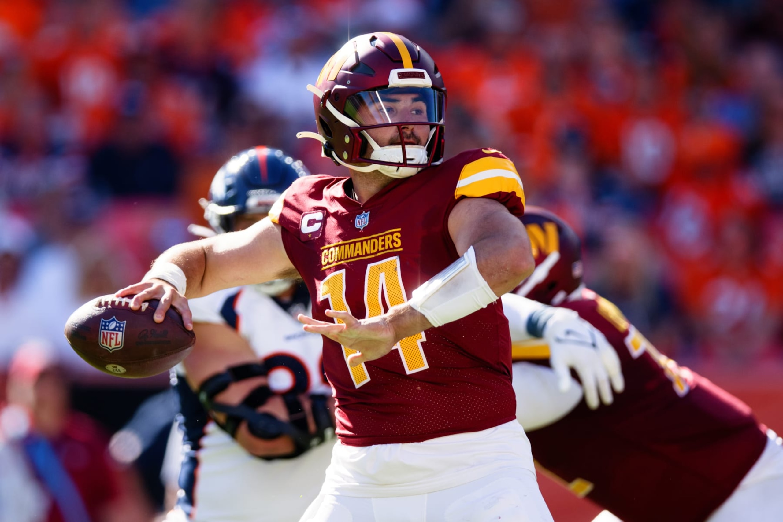 DENVER, CO - SEPTEMBER 17:  Quarterback Sam Howell #14 of the Washington Commanders throws a pass during the second quarter against the Denver Broncos at Empower Field at Mile High on September 17, 2023 in Denver, Colorado. (Photo by Justin Edmonds/Getty Images)