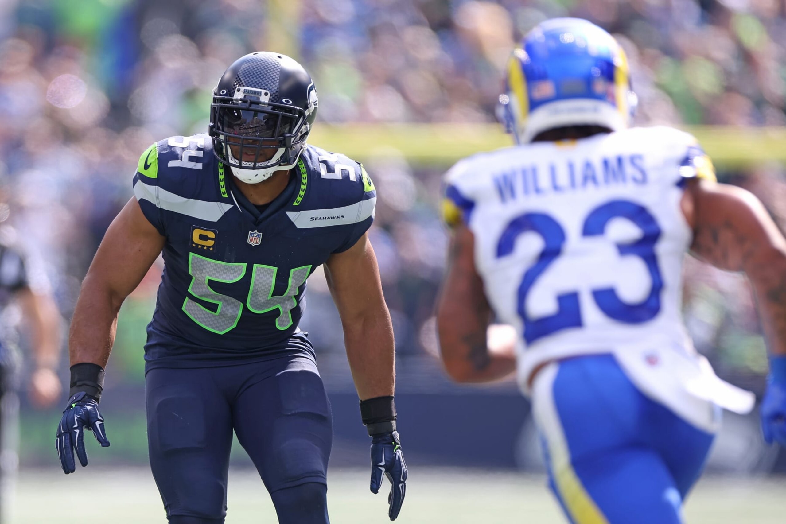 SEATTLE, WASHINGTON - SEPTEMBER 10:  Bobby Wagner #54 of the Seattle Seahawks in play against Kyren Williams #23 of the Los Angeles Rams during the first half at Lumen Field on September 10, 2023 in Seattle, Washington. (Photo by Steph Chambers/Getty Images)