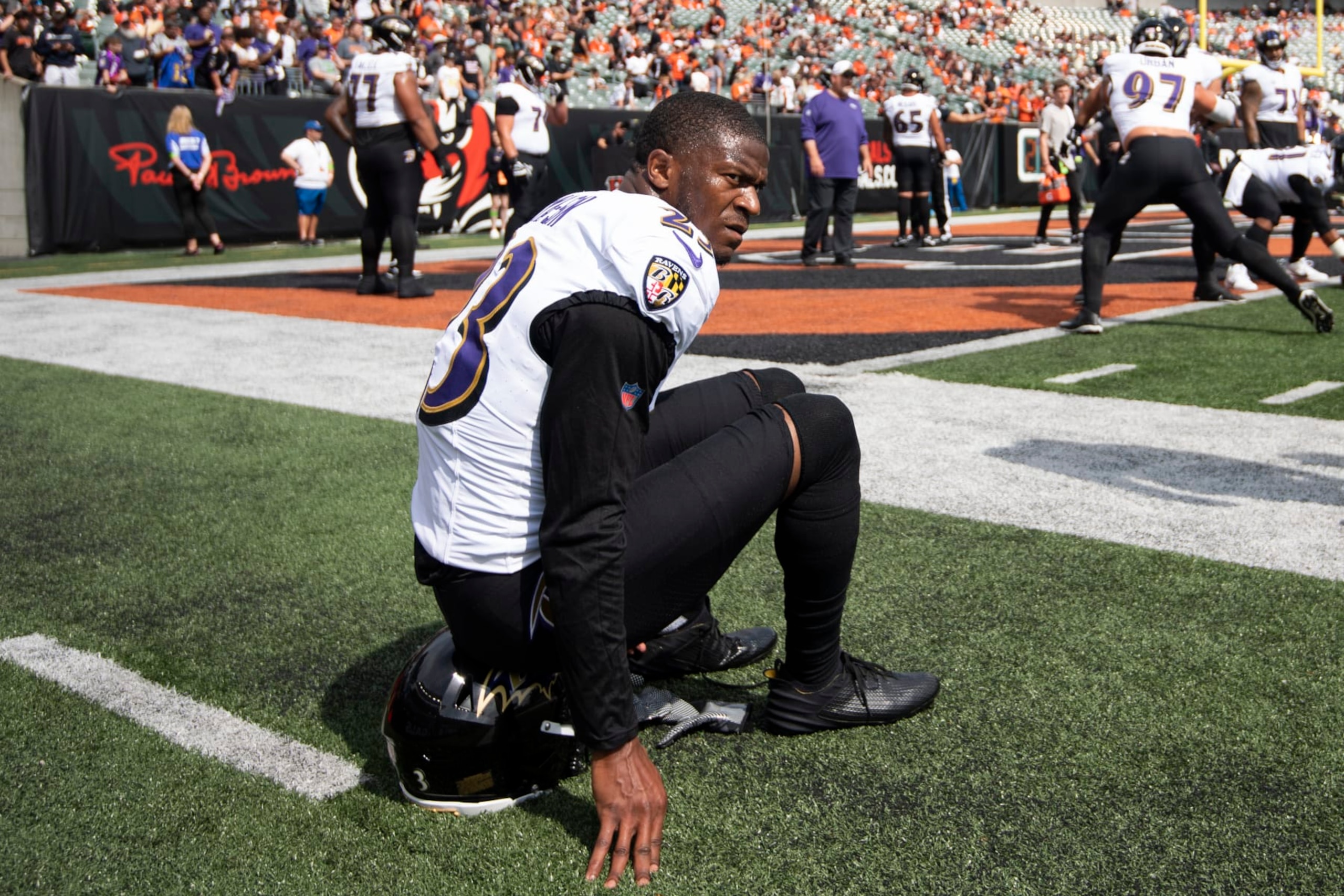 Baltimore Ravens cornerback Rock Ya-Sin (23) sits on his helmet during warmups before an NFL football game against the Cincinnati Bengals on Sunday, Sept. 17, 2023, in Cincinnati. (AP Photo/Emilee Chinn)