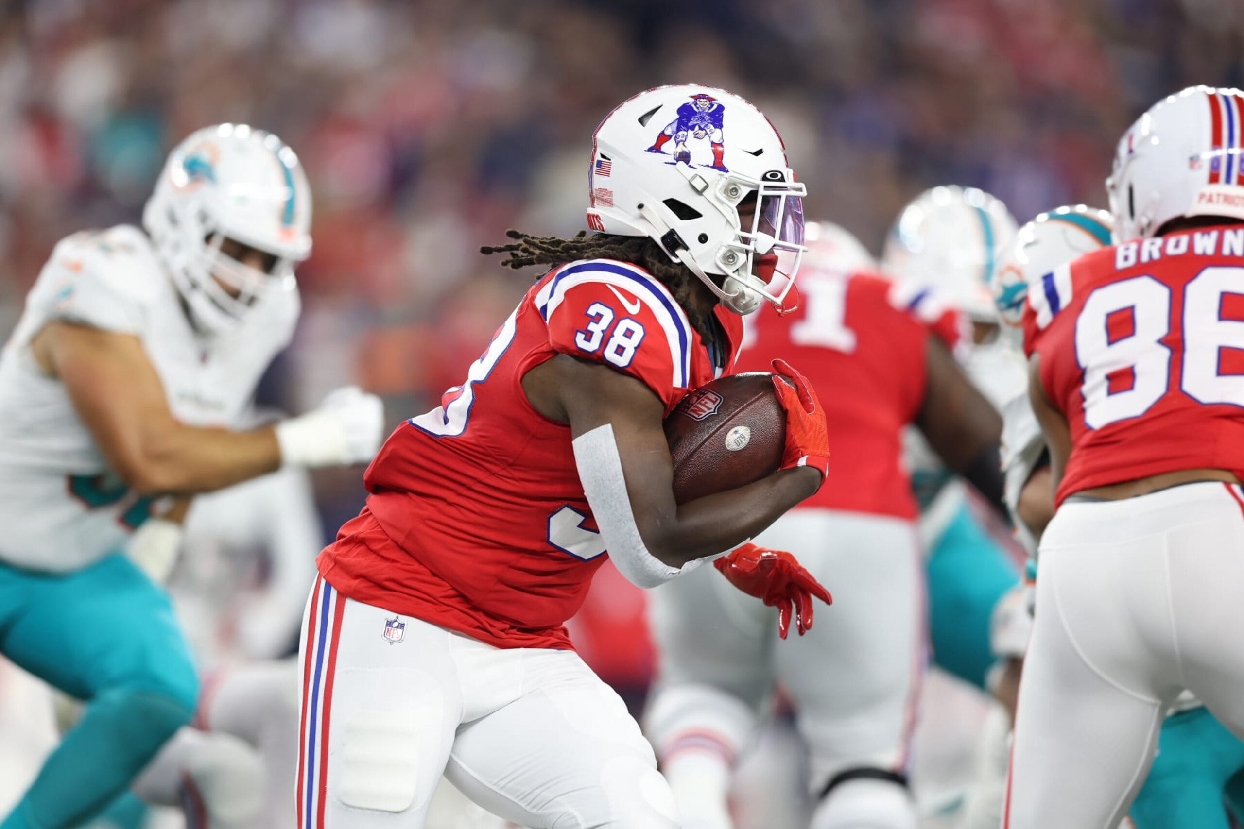 FOXBOROUGH, MASSACHUSETTS - SEPTEMBER 17: Rhamondre Stevenson #38 of the New England Patriots runs the ball during the first quarter against the Miami Dolphins at Gillette Stadium on September 17, 2023 in Foxborough, Massachusetts. (Photo by Adam Glanzman/Getty Images)