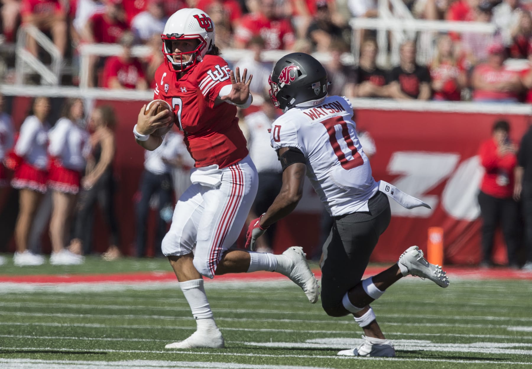 SALT LAKE CITY, UT -  SEPTEMBER 25 : Cam Rising #7  of the Utah Utes rushes out of the pocket under pressure from Jaylen Watson #0 of the Washington State Cougars  during their game September 25, 2021 at Rice Eccles Stadium in Salt Lake City, Utah. (Photo by Chris Gardner/Getty Images)