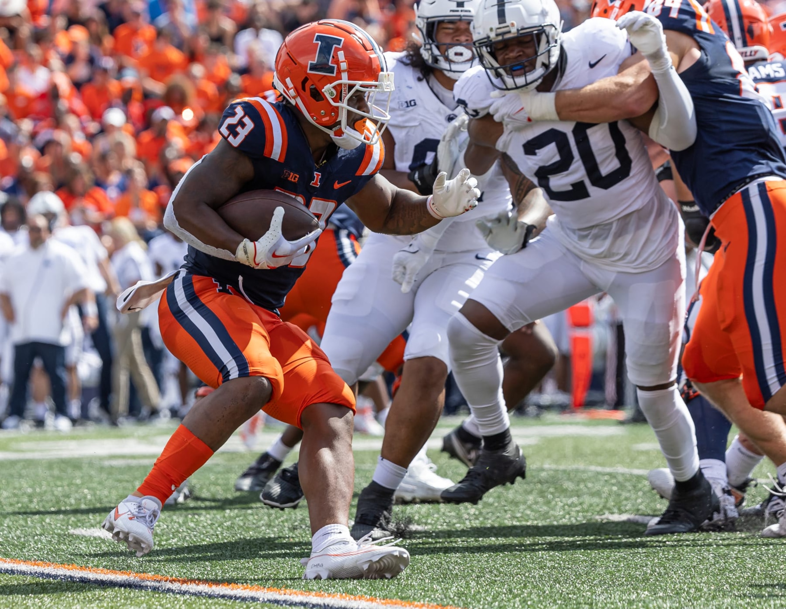 CHAMPAIGN, ILLINOIS - SEPTEMBER 16: Reggie Love III #23 of the Illinois Fighting Illini runs the ball during the game against the Penn State Nittany Lions at Memorial Stadium on September 16, 2023 in Champaign, Illinois. (Photo by Michael Hickey/Getty Images)
