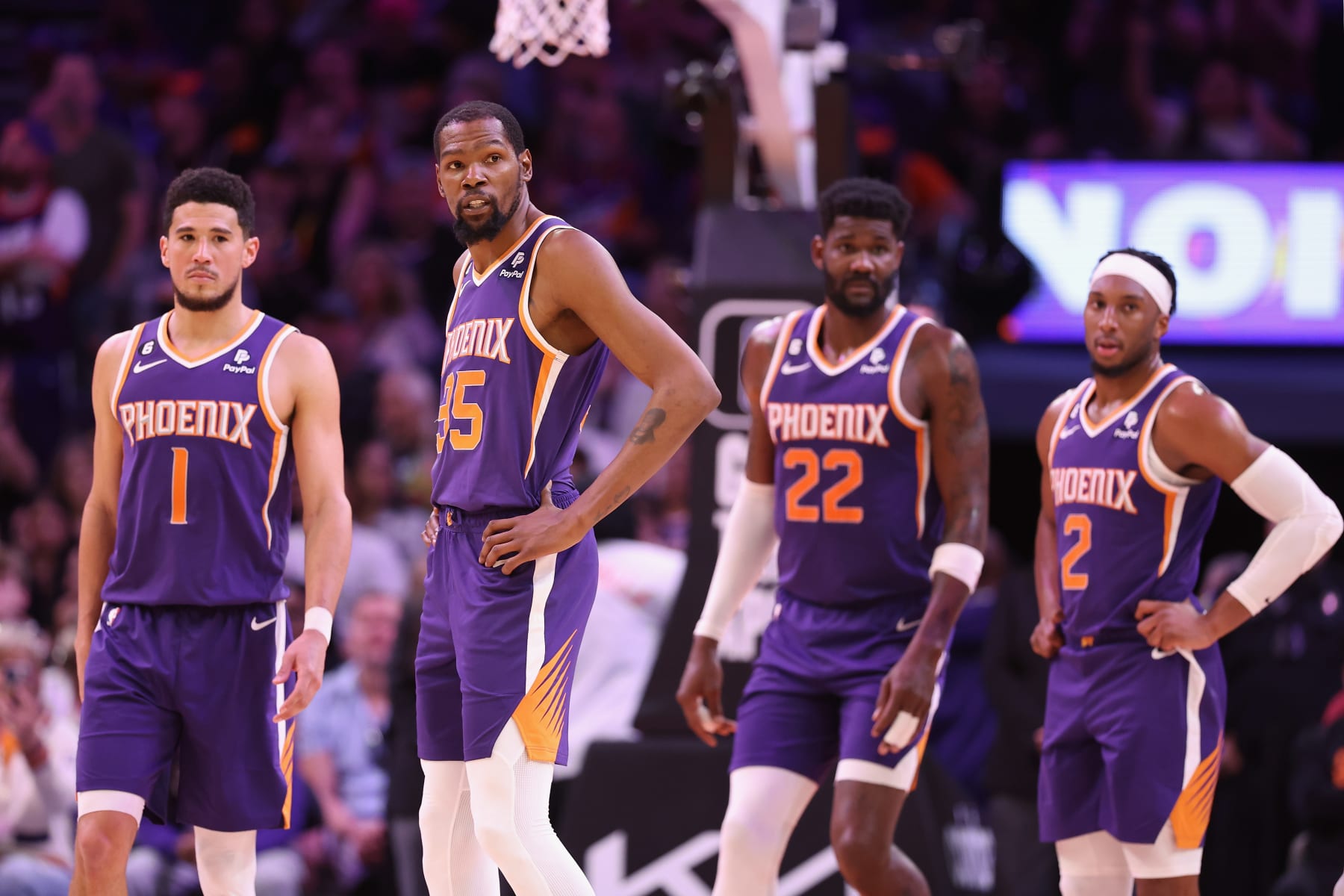 PHOENIX, ARIZONA - MARCH 29: (L-R) Devin Booker #1, Kevin Durant #35, Deandre Ayton #22 and Josh Okogie #2 of the Phoenix Suns stand on the court during a timeout from the second half of the NBA game against the Minnesota Timberwolves at Footprint Center on March 29, 2023 in Phoenix, Arizona. The Suns defeated the Timberwolves 107-100. NOTE TO USER: User expressly acknowledges and agrees that, by downloading and or using this photograph, User is consenting to the terms and conditions of the Getty Images License Agreement. (Photo by Christian Petersen/Getty Images) PHOENIX, ARIZONA - MARCH 29: (L-R) Devin Booker #1, Kevin Durant #35, Deandre Ayton #22 and Josh Okogie #2 of the Phoenix Suns stand on the court during a timeout from the second half of the NBA game against the Minnesota Timberwolves at Footprint Center on March 29, 2023 in Phoenix, Arizona. The Suns defeated the Timberwolves 107-100. NOTE TO USER: User expressly acknowledges and agrees that, by downloading and or using this photograph, User is consenting to the terms and conditions of the Getty Images License Agreement. (Photo by Christian Petersen/Getty Images)