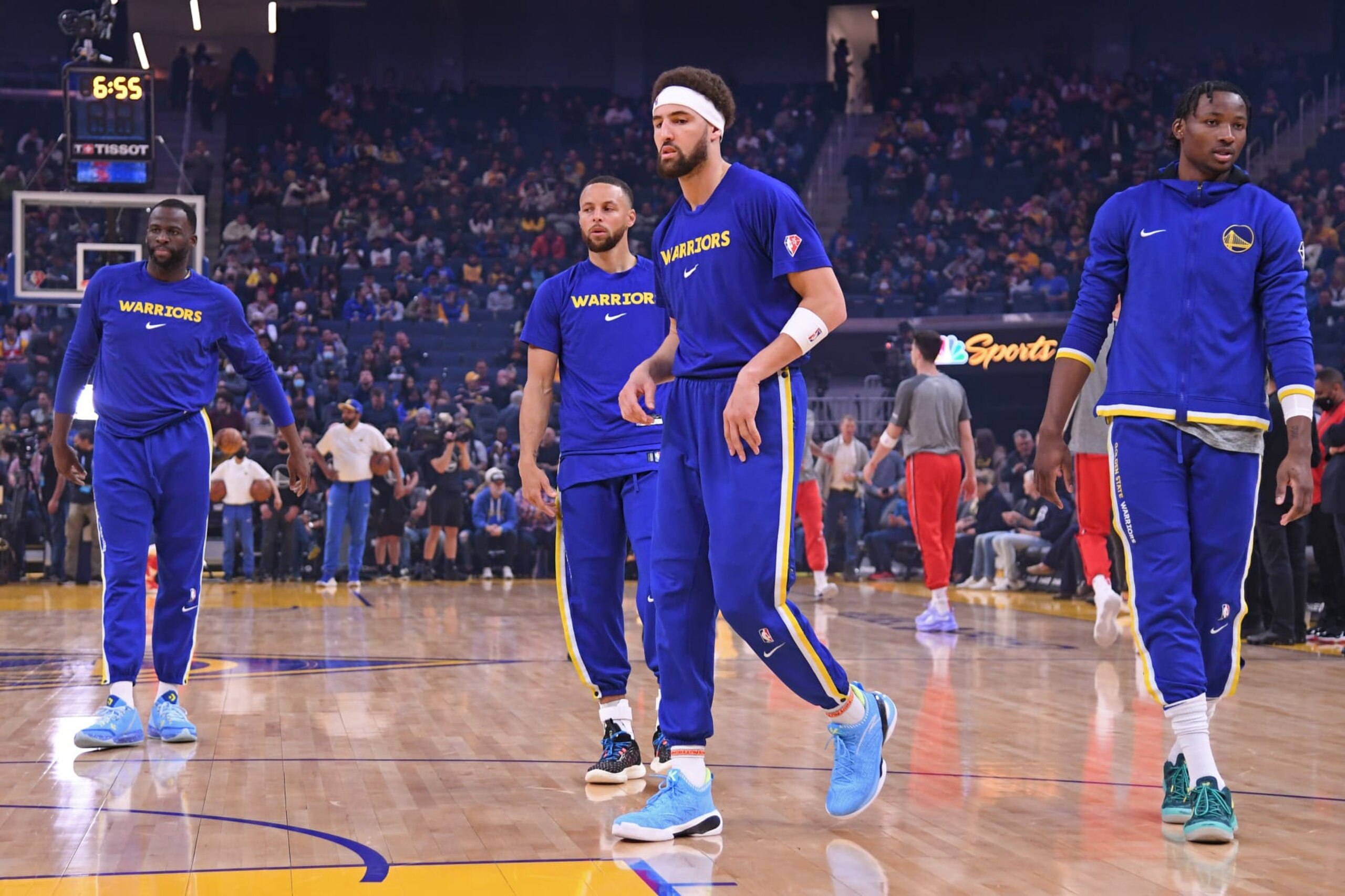 SAN FRANCISCO, CA - MARCH 14: Draymond Green #23, Stephen Curry #30, Klay Thompson #11 and Jonathan Kuminga #00 of the Golden State Warriors look on before the game against the Washington Wizards on March 14, 2022 at Chase Center in San Francisco, California. NOTE TO USER: User expressly acknowledges and agrees that, by downloading and or using this photograph, user is consenting to the terms and conditions of Getty Images License Agreement. Mandatory Copyright Notice: Copyright 2022 NBAE (Photo by Noah Graham/NBAE via Getty Images)