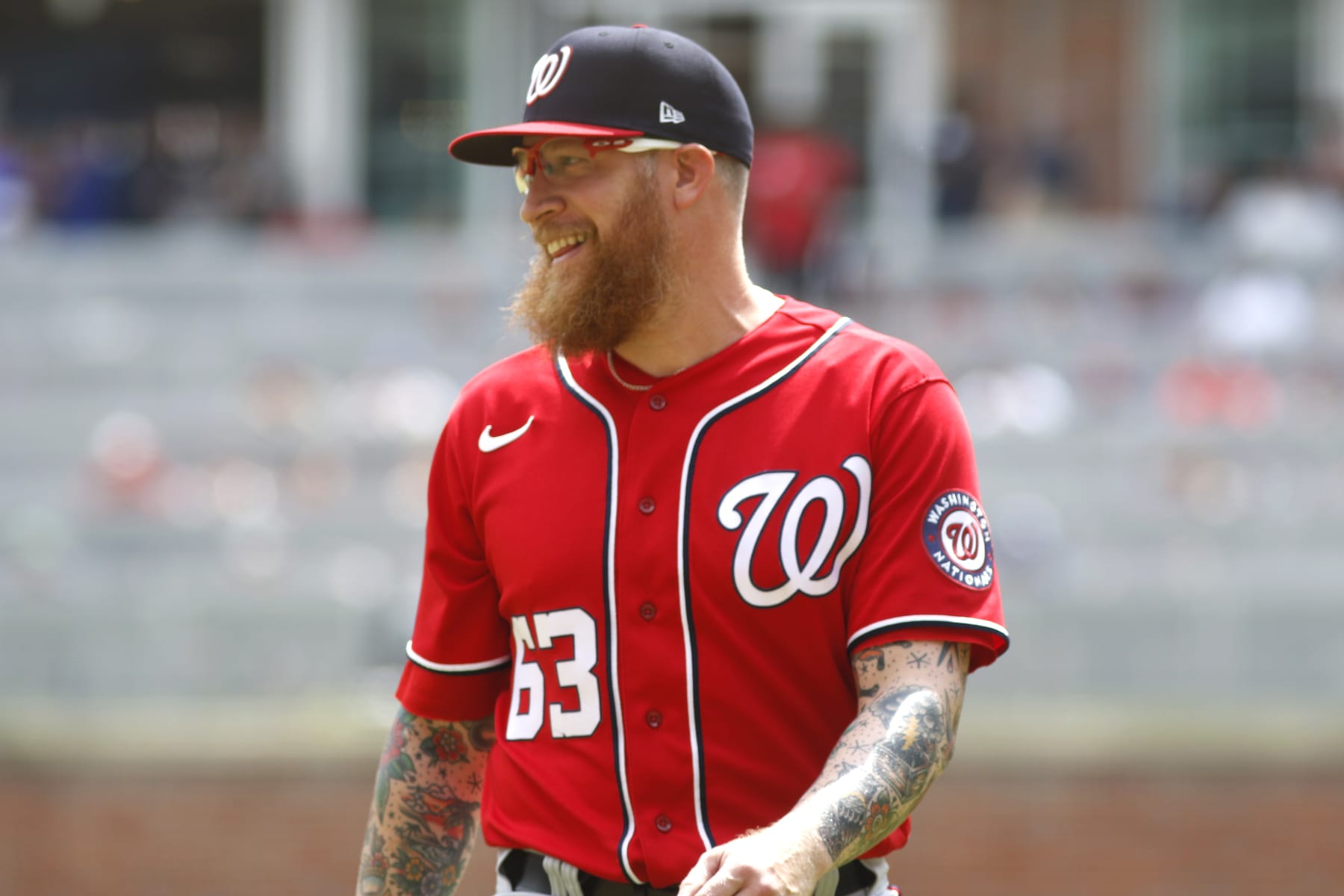 ATLANTA, GA - APRIL 13: Sean Doolittle #63 of the Washington Nationals smiles after delivering a pitch during the MLB game between the Atlanta Braves and the Washington Nationals on April 13, 2022 at TRUIST Park in Atlanta, GA. (Photo by Jeff Robinson/Icon Sportswire via Getty Images)