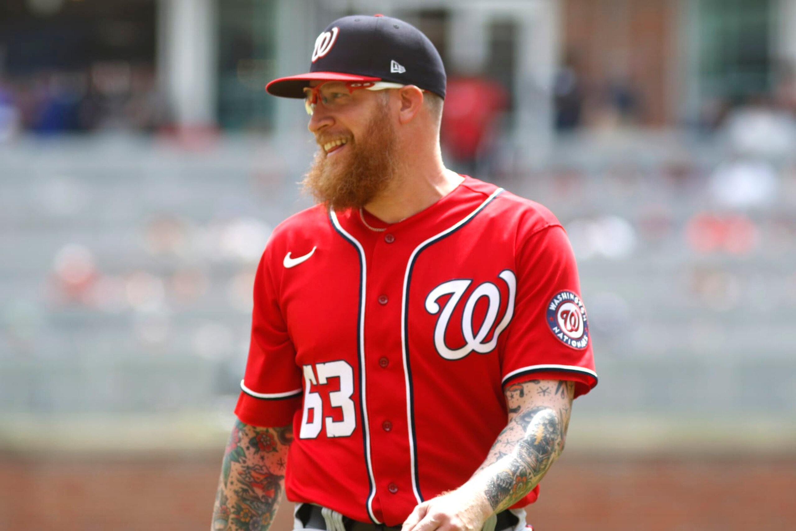 ATLANTA, GA - APRIL 13: Sean Doolittle #63 of the Washington Nationals smiles after delivering a pitch during the MLB game between the Atlanta Braves and the Washington Nationals on April 13, 2022 at TRUIST Park in Atlanta, GA. (Photo by Jeff Robinson/Icon Sportswire via Getty Images)