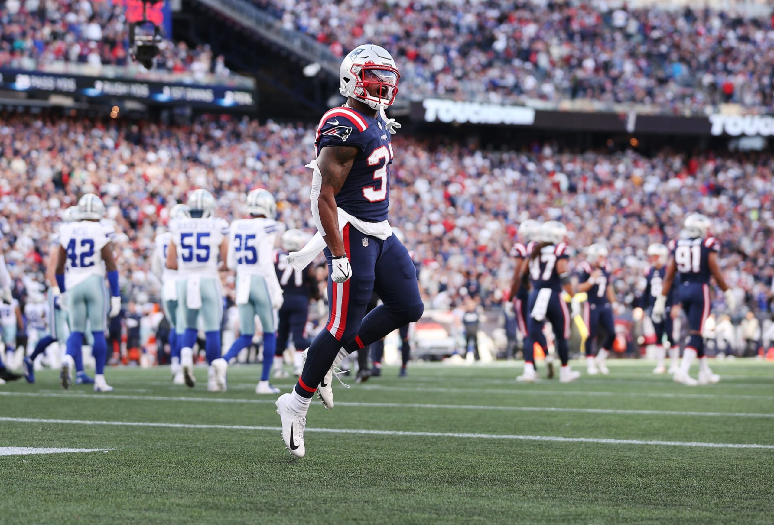 FOXBOROUGH, MASSACHUSETTS - OCTOBER 17: Damien Harris #37 of the New England Patriots celebrates after scoring a touchdown against the Dallas Cowboys in the first quarter at Gillette Stadium on October 17, 2021 in Foxborough, Massachusetts. (Photo by Maddie Meyer/Getty Images)