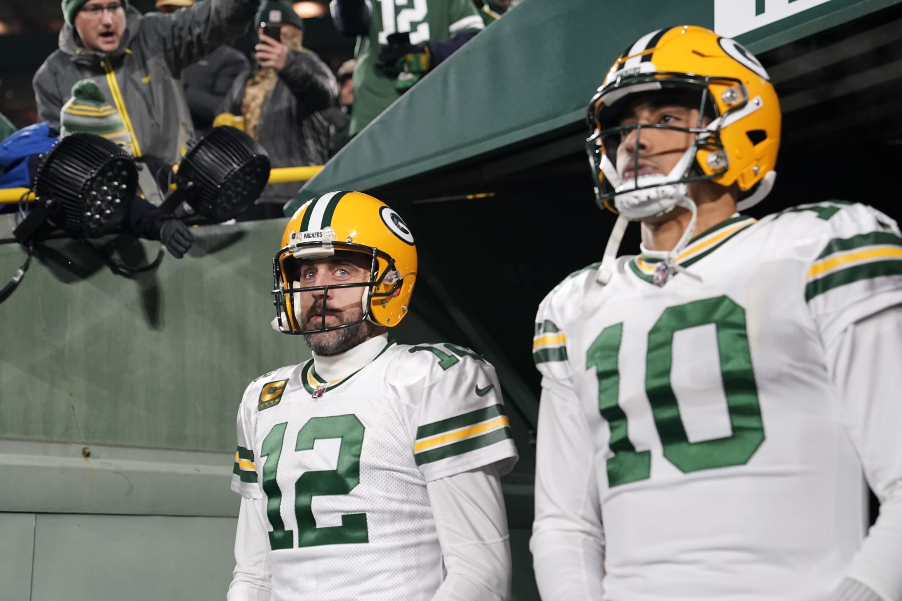 GREEN BAY, WISCONSIN - NOVEMBER 17: Aaron Rodgers #12 and Jordan Love #10 of the Green Bay Packers walk onto the field prior to the game against the Tennessee Titans at Lambeau Field on November 17, 2022 in Green Bay, Wisconsin. (Photo by Patrick McDermott/Getty Images)