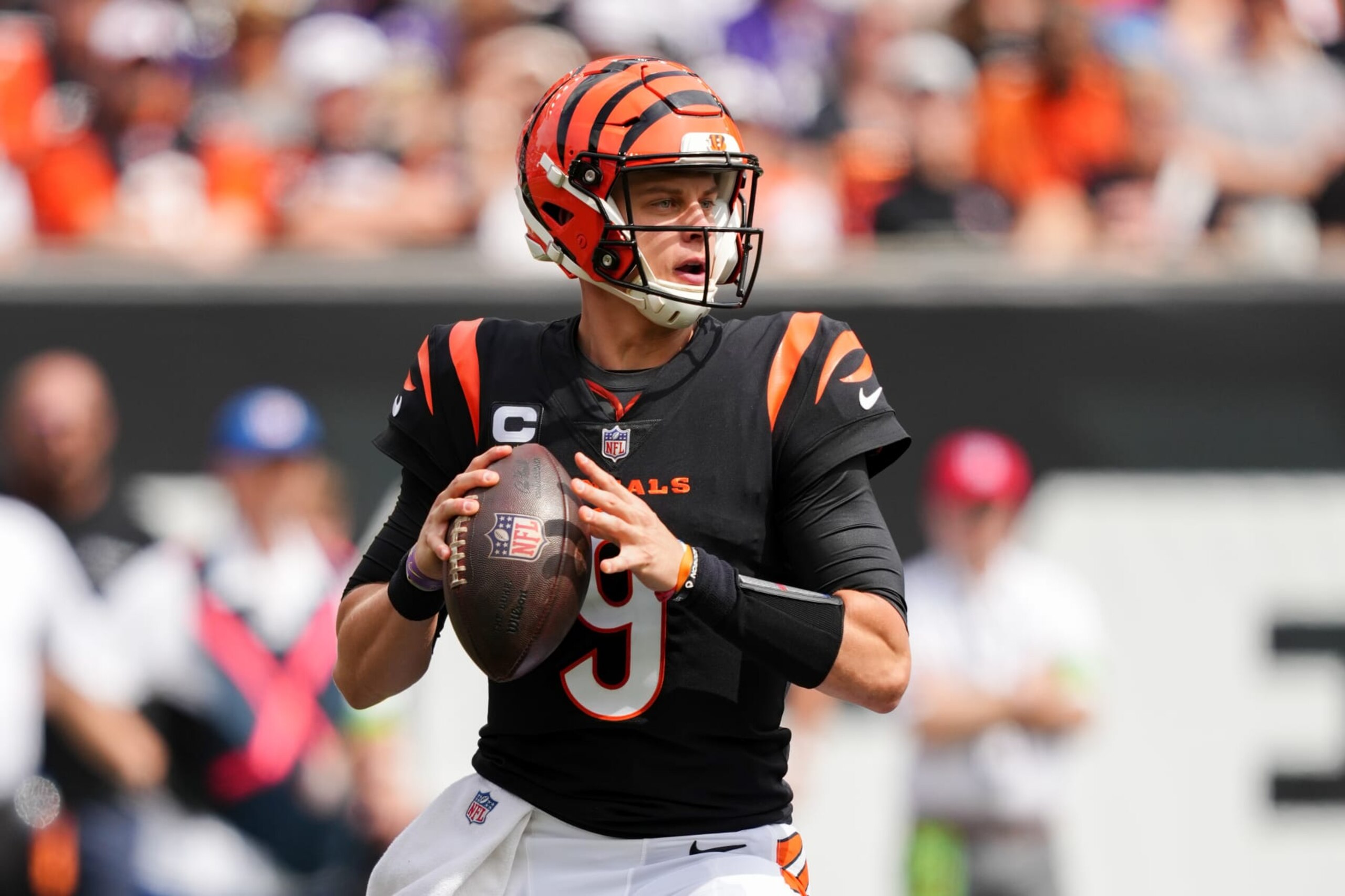 CINCINNATI, OHIO - SEPTEMBER 17: Joe Burrow #9 of the Cincinnati Bengals drops back to pass in the first quarter against the Baltimore Ravens at Paycor Stadium on September 17, 2023 in Cincinnati, Ohio. (Photo by Dylan Buell/Getty Images) CINCINNATI, OHIO - SEPTEMBER 17: Joe Burrow #9 of the Cincinnati Bengals drops back to pass in the first quarter against the Baltimore Ravens at Paycor Stadium on September 17, 2023 in Cincinnati, Ohio. (Photo by Dylan Buell/Getty Images)