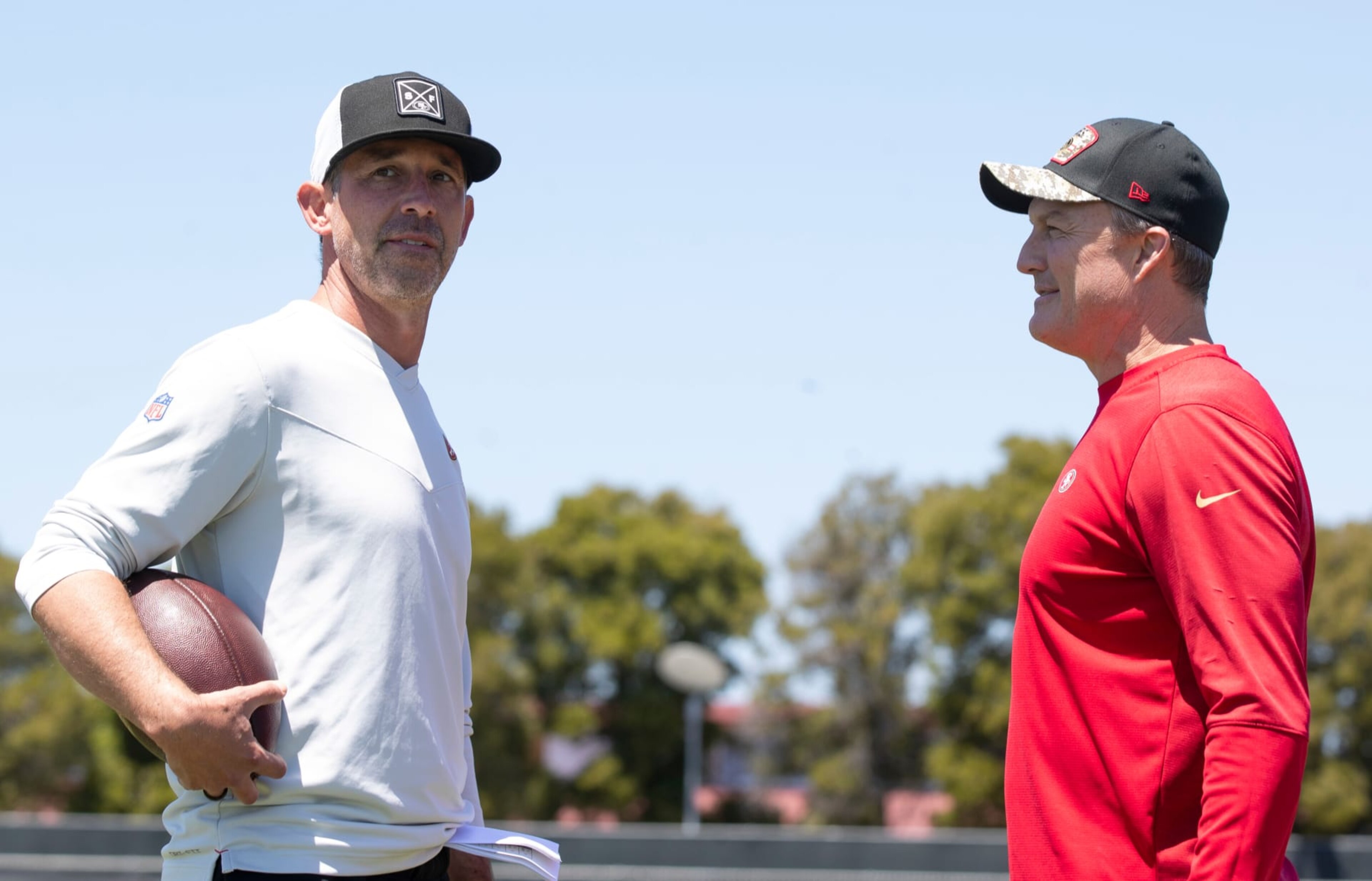 SANTA CLARA, CA - MAY 12: Head Coach Kyle Shanahan and General Manager John Lynch of the San Francisco 49ers during rookie training camp at the SAP Performance Facility on May 12, 2023 in Santa Clara, California. (Photo by Michael Zagaris/San Francisco 49ers/Getty Images) SANTA CLARA, CA - MAY 12: Head Coach Kyle Shanahan and General Manager John Lynch of the San Francisco 49ers during rookie training camp at the SAP Performance Facility on May 12, 2023 in Santa Clara, California. (Photo by Michael Zagaris/San Francisco 49ers/Getty Images)