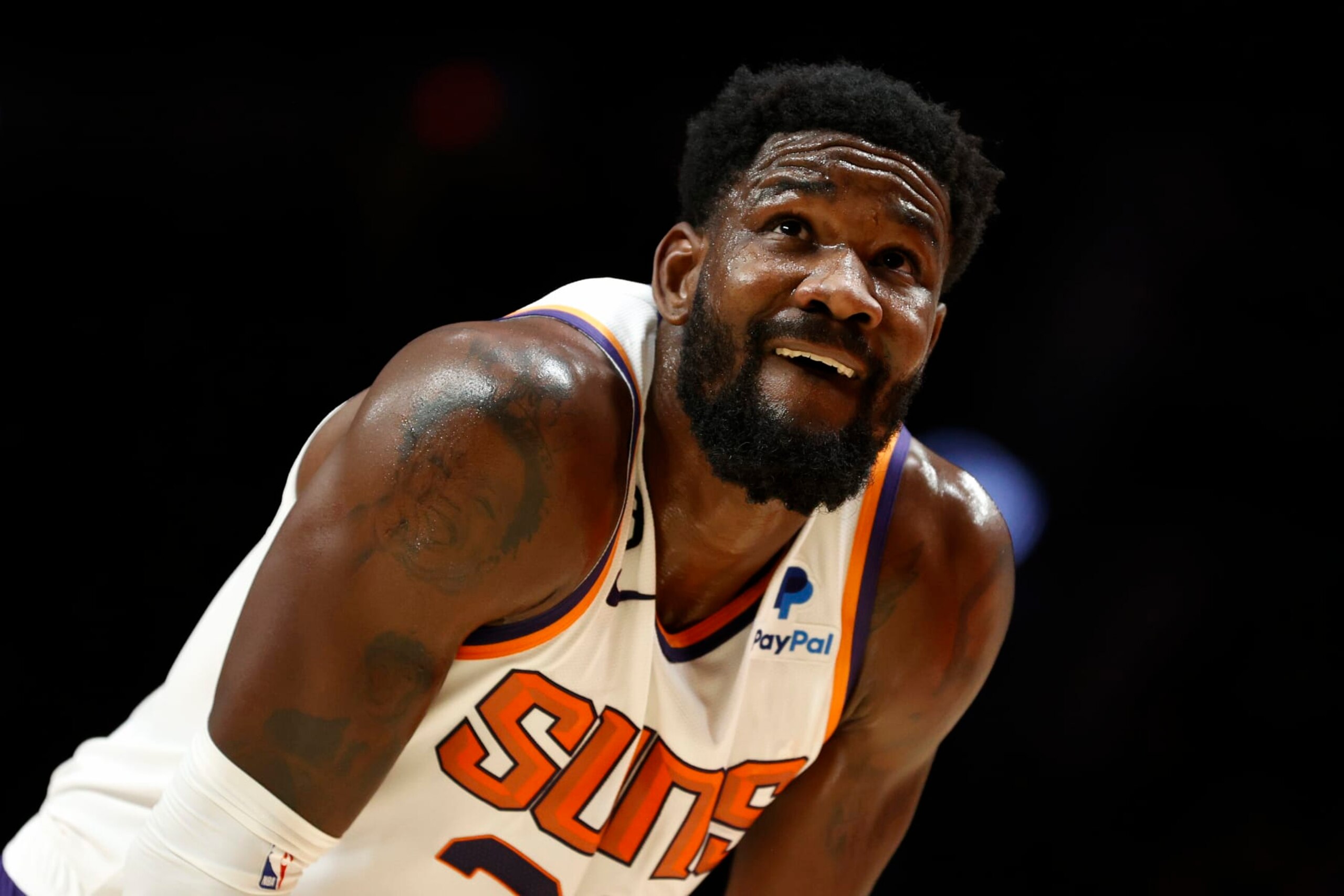 PORTLAND, OREGON - OCTOBER 21: Deandre Ayton #22 of the Phoenix Suns looks on during the first quarter against the Portland Trail Blazers at Moda Center on October 21, 2022 in Portland, Oregon. NOTE TO USER: User expressly acknowledges and agrees that, by downloading and or using this photograph, User is consenting to the terms and conditions of the Getty Images License Agreement. (Photo by Steph Chambers/Getty Images)