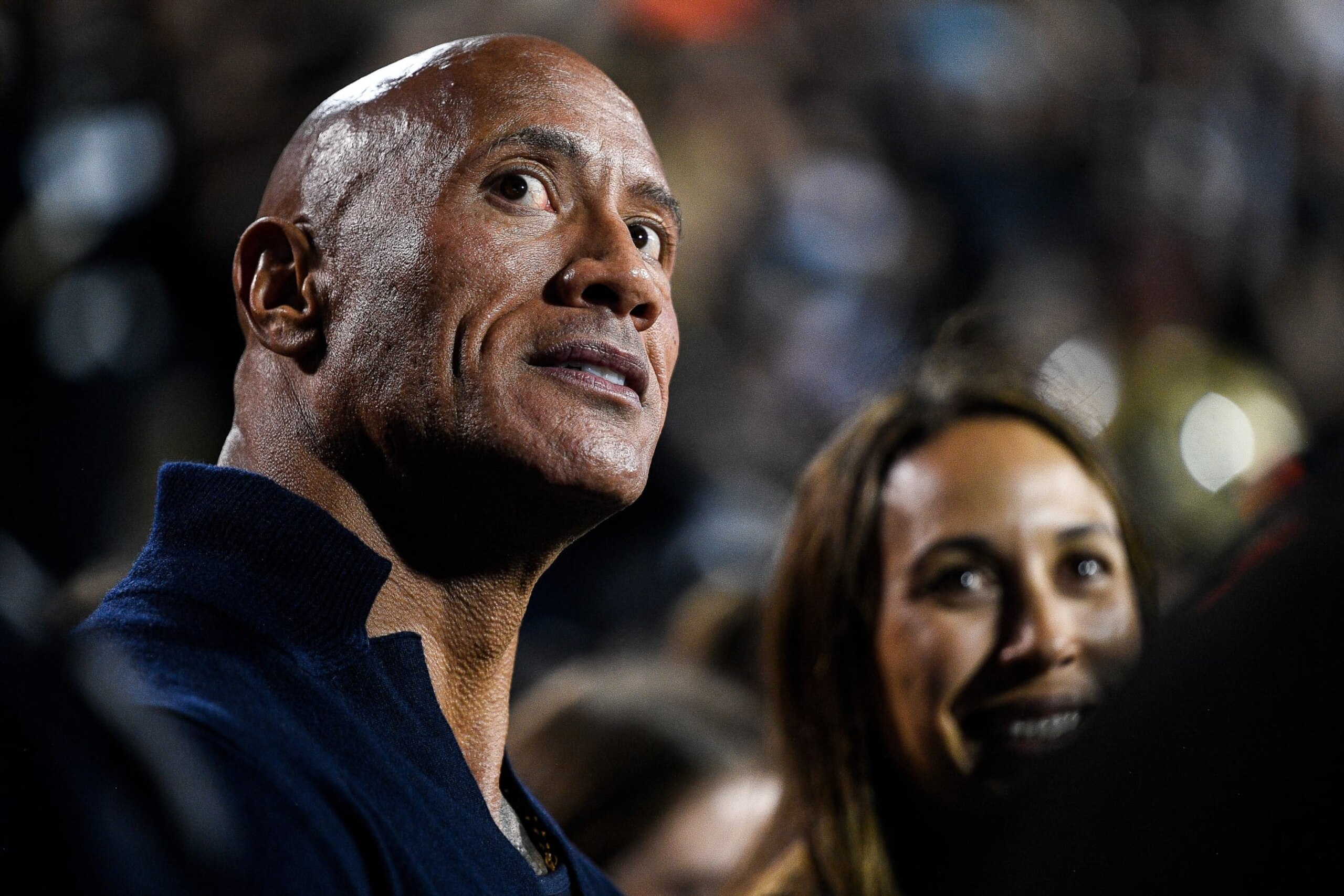 BOULDER, CO - SEPTEMBER 16:  Dwayne The Rock Johnson stands on the sideline in the first half of a game between the Colorado Buffaloes and the Colorado State Rams at Folsom Field on September 16, 2023 in Boulder, Colorado. (Photo by Dustin Bradford/Getty Images)