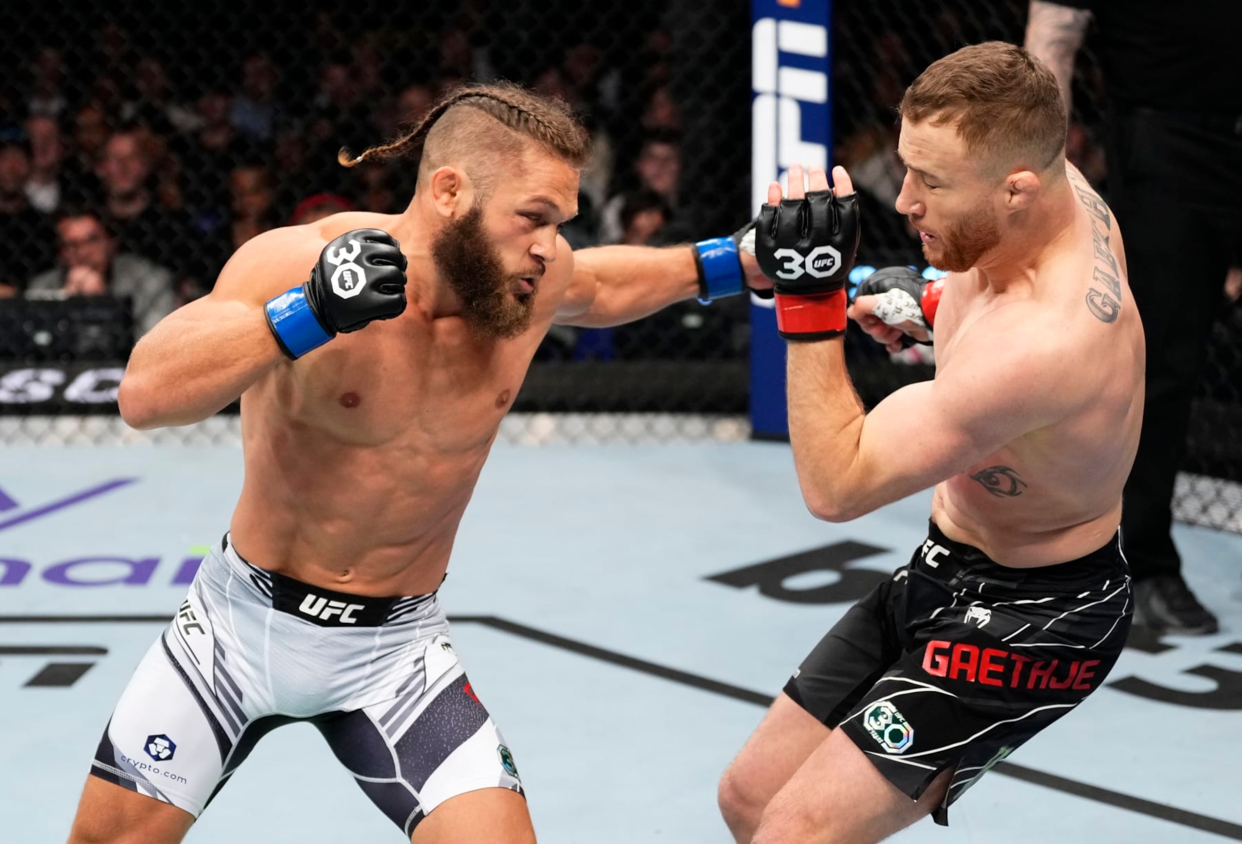 LONDON, ENGLAND - MARCH 18: (L-R) Rafael Fiziev of Kazakstan punches Justin Gaethje in a lightweight fight during the UFC 286 event at The O2 Arena on March 18, 2023 in London, England. (Photo by Jeff Bottari/Zuffa LLC via Getty Images)