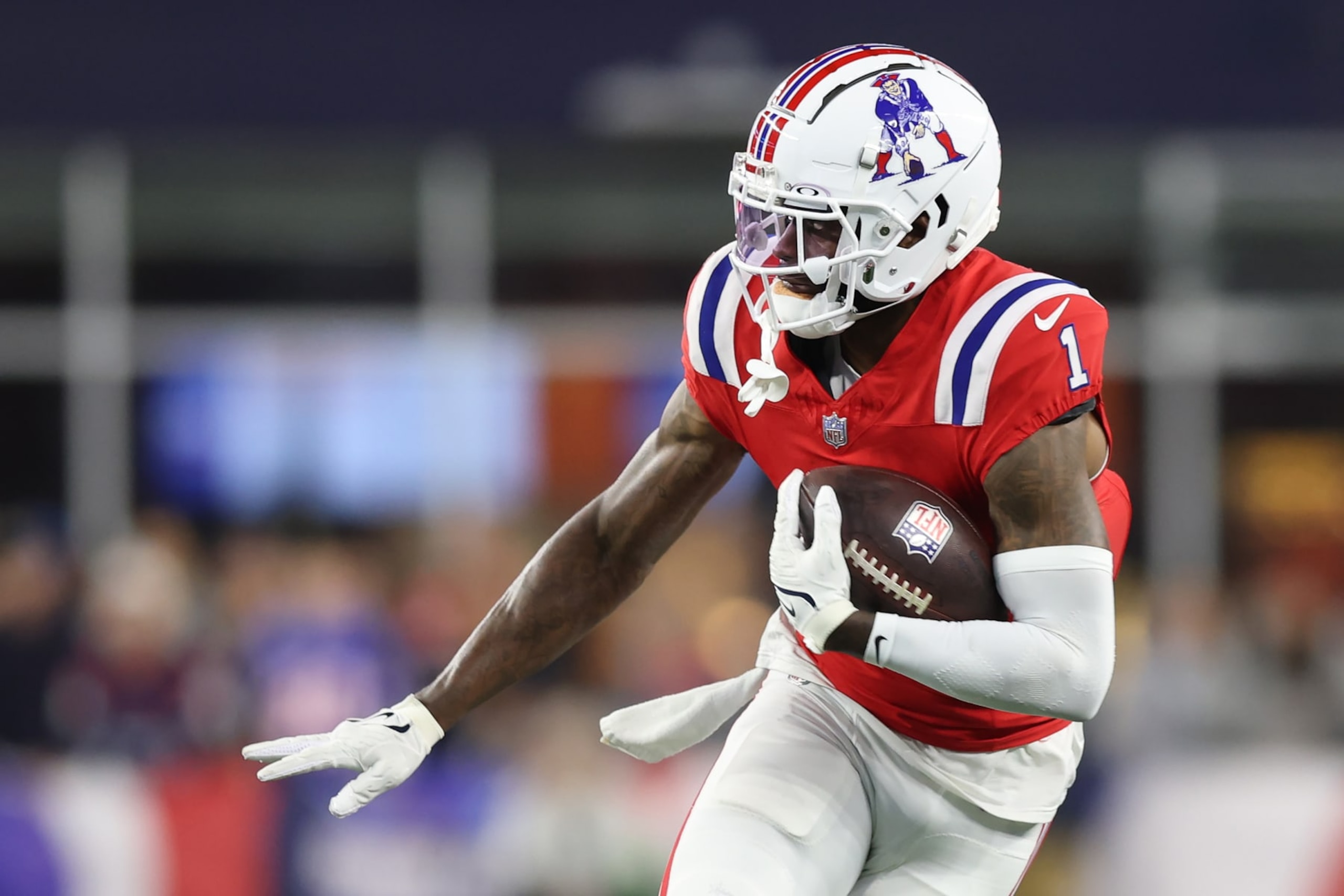 FOXBOROUGH, MASSACHUSETTS - SEPTEMBER 17: DeVante Parker #1 of the New England Patriots runs with the ball during the game against the Miami Dolphins at Gillette Stadium on September 17, 2023 in Foxborough, Massachusetts. (Photo by Adam Glanzman/Getty Images)