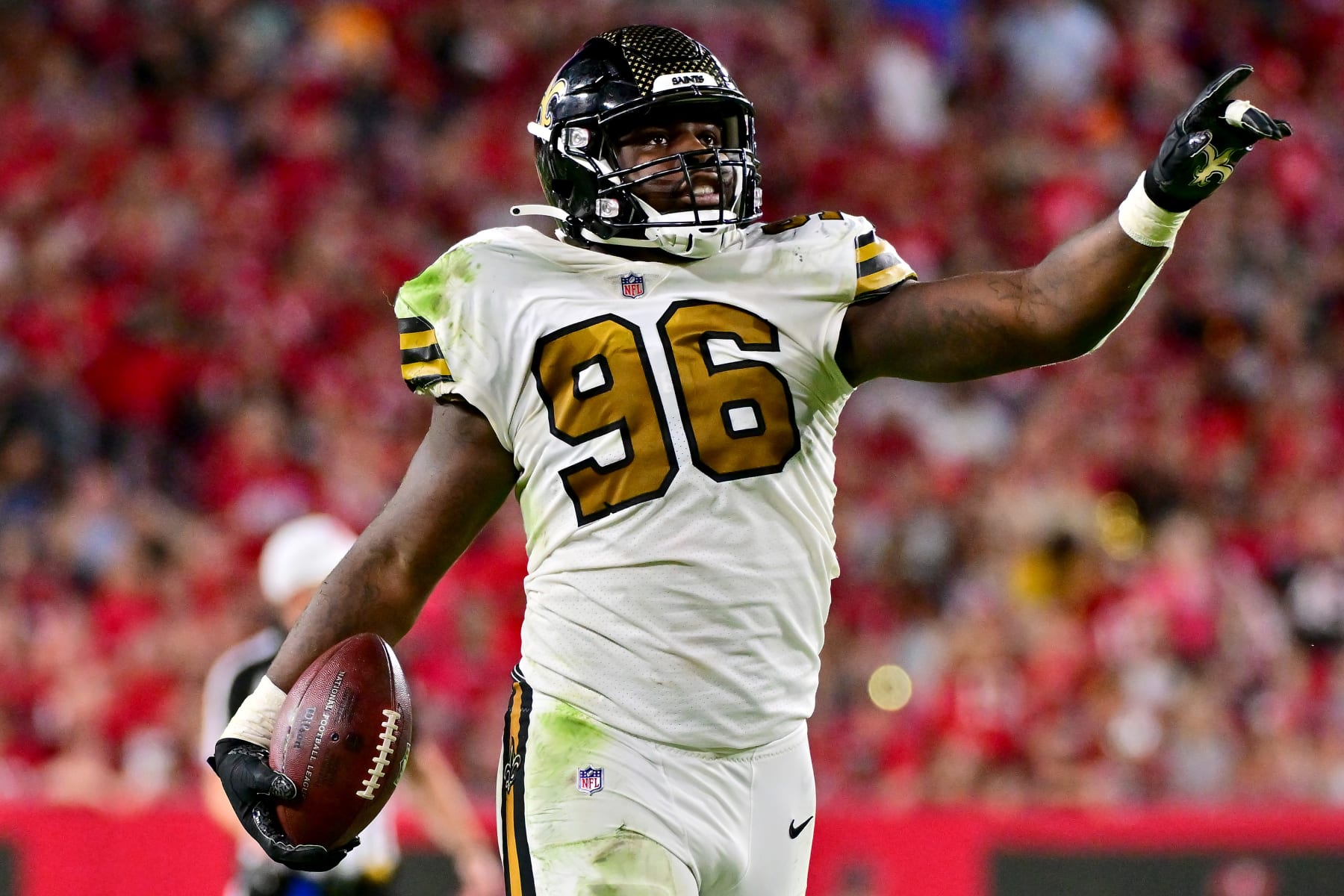TAMPA, FLORIDA - DECEMBER 05: Carl Granderson #96 of the New Orleans Saints celebrates after recovering a fumble against the Tampa Bay Buccaneers during the third quarter in the game at Raymond James Stadium on December 05, 2022 in Tampa, Florida. (Photo by Julio Aguilar/Getty Images)