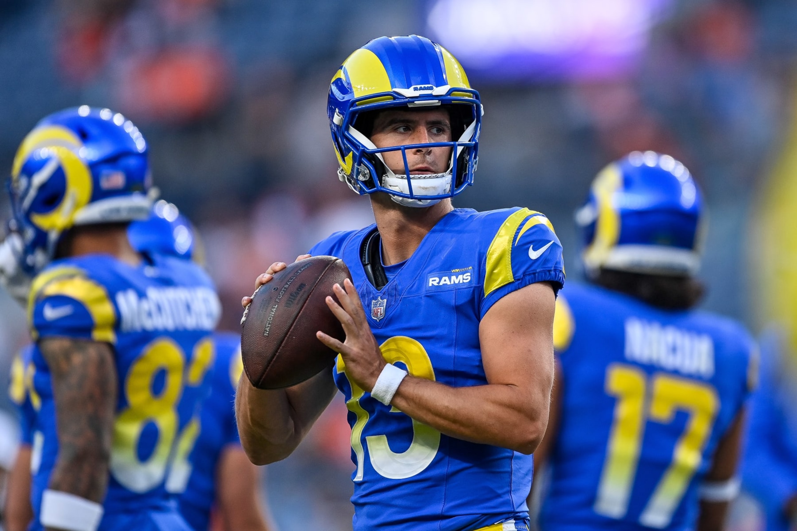 DENVER, COLORADO - AUGUST 26:  Quarterback Stetson Bennett #13 of the Los Angeles Rams warms up before a preseason game against the Denver Broncos at Empower Field at Mile High on August 26, 2023 in Denver, Colorado. (Photo by Dustin Bradford/Getty Images)
