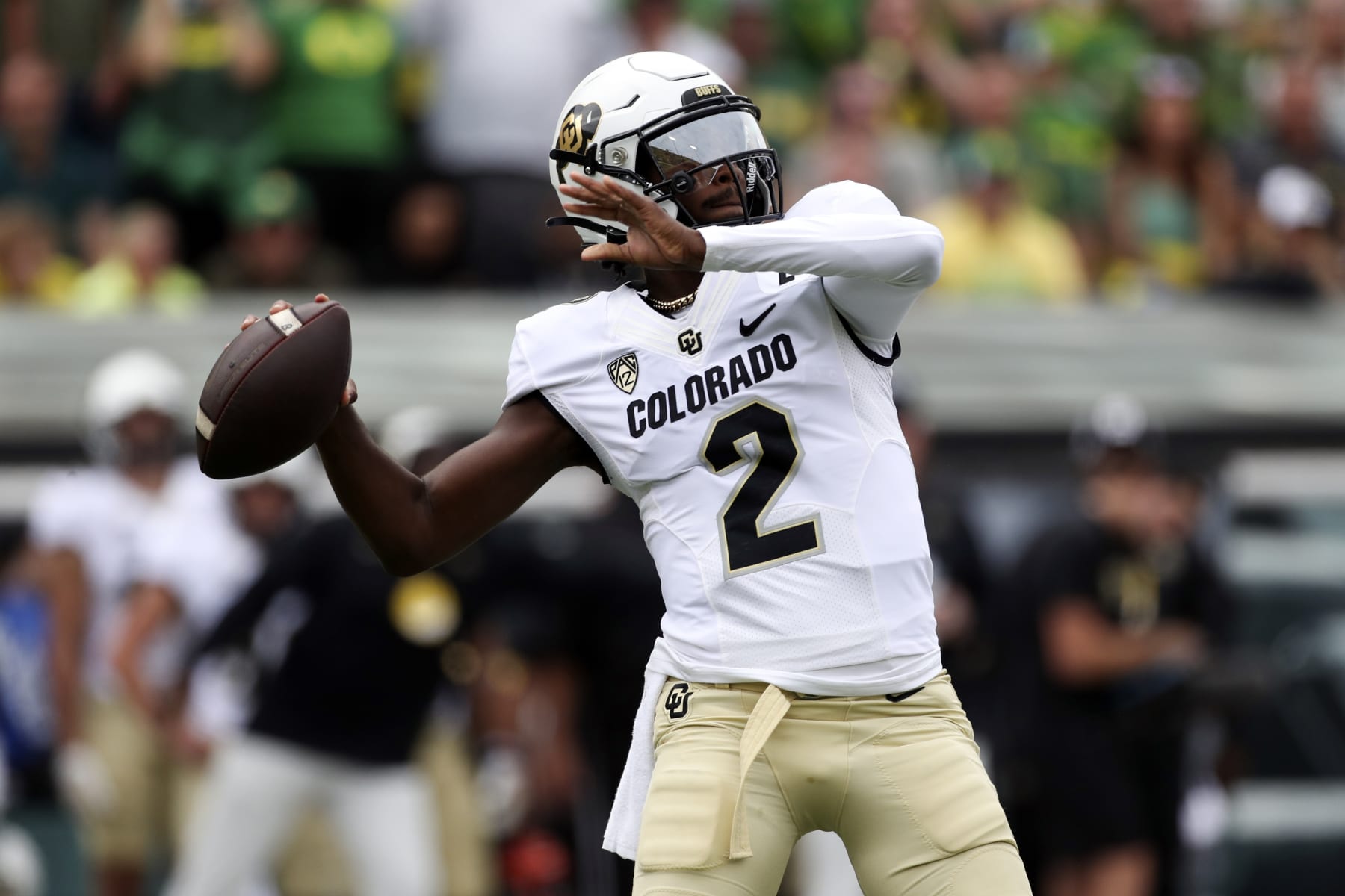 Colorado quarterback Shedeur Sanders reaches back to pass against Oregon during the first half of an NCAA football game, Saturday, Sept. 23, 2023, in Eugene, Ore. (AP Photo/Amanda Loman)