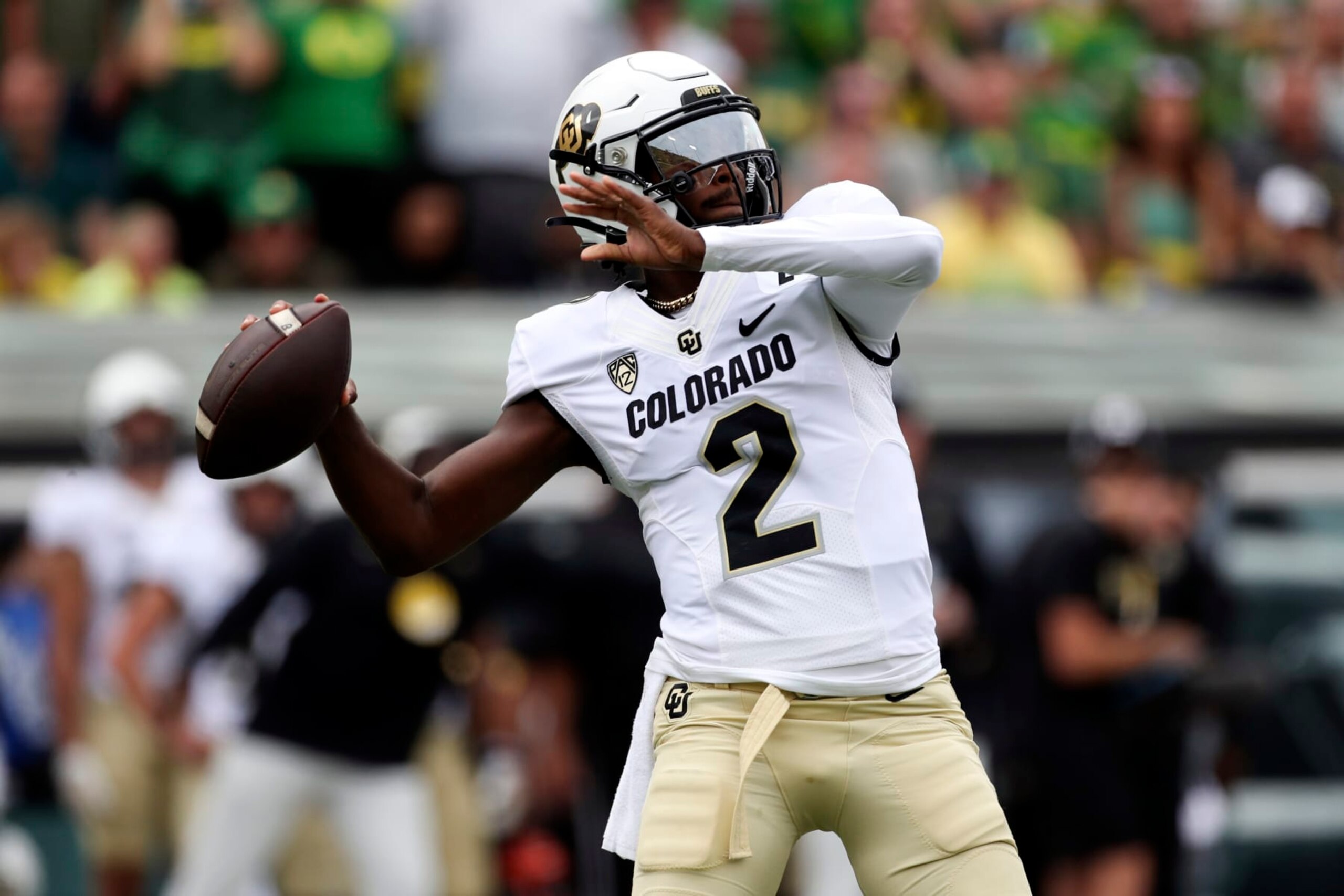 Colorado quarterback Shedeur Sanders reaches back to pass against Oregon during the first half of an NCAA football game, Saturday, Sept. 23, 2023, in Eugene, Ore. (AP Photo/Amanda Loman)