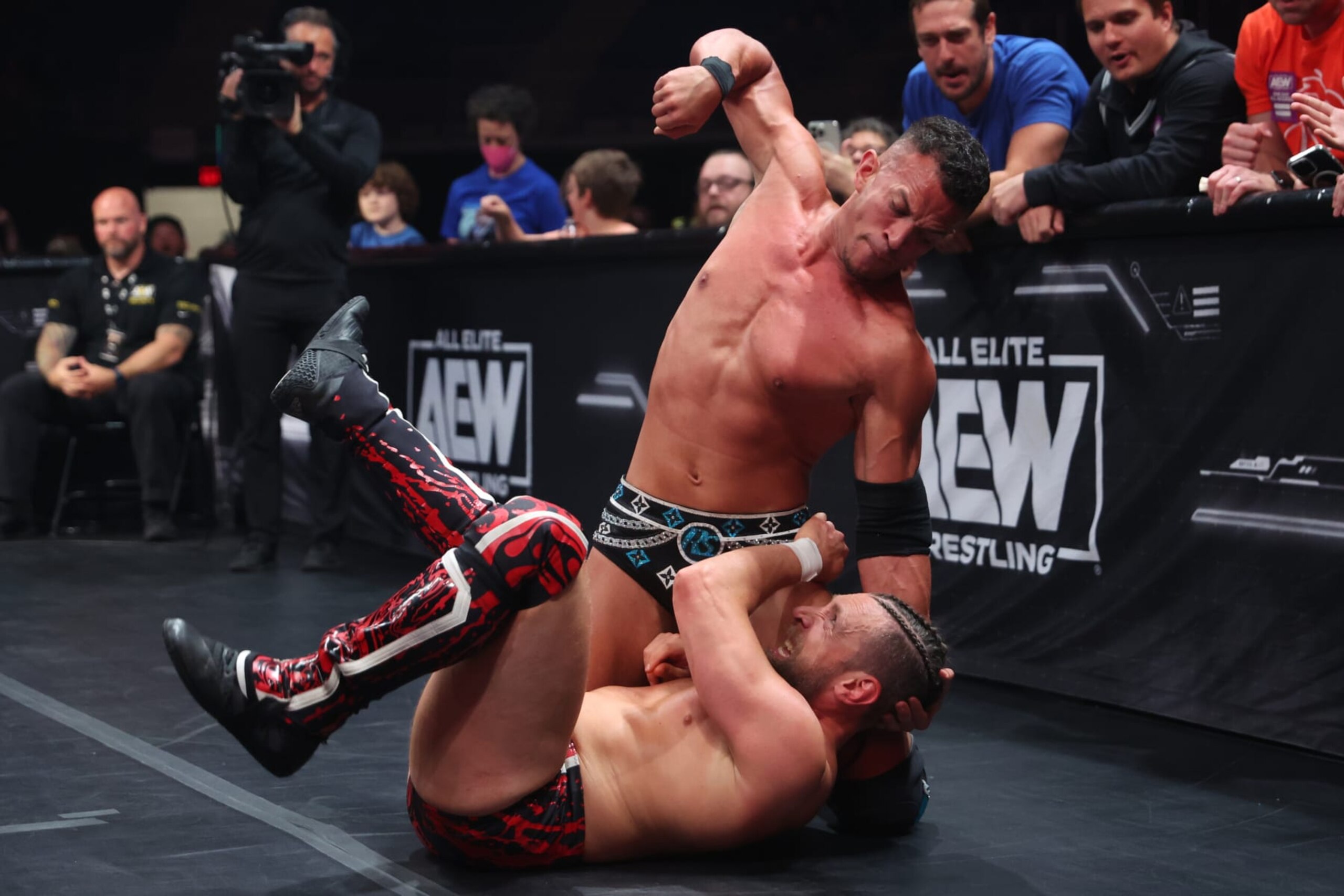 Ricky Starks punching Bryan Danielson. 