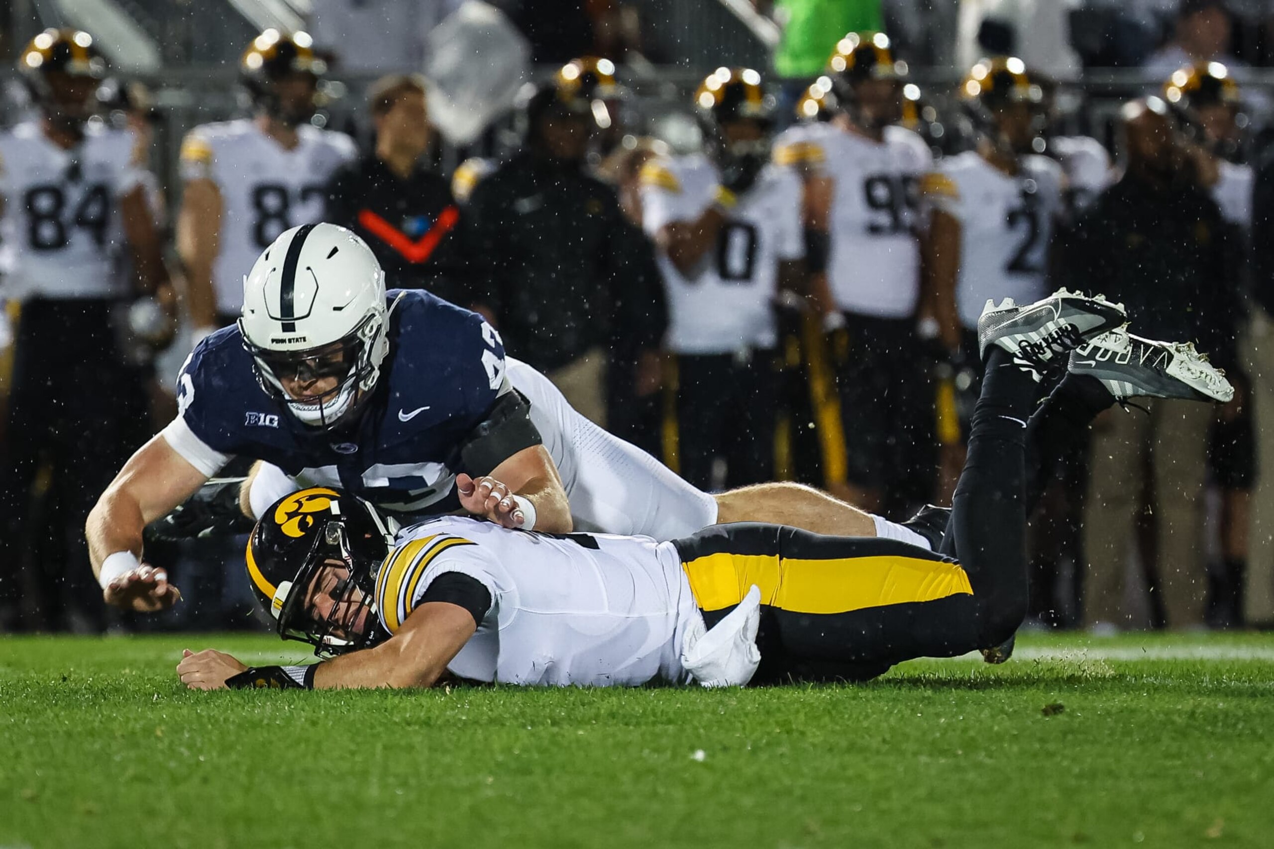STATE COLLEGE, PA - SEPTEMBER 23: Tyler Elsdon #43 of the Penn State Nittany Lions hits Cade McNamara #12 of the Iowa Hawkeyes during the first half at Beaver Stadium on September 23, 2023 in State College, Pennsylvania. (Photo by Scott Taetsch/Getty Images)