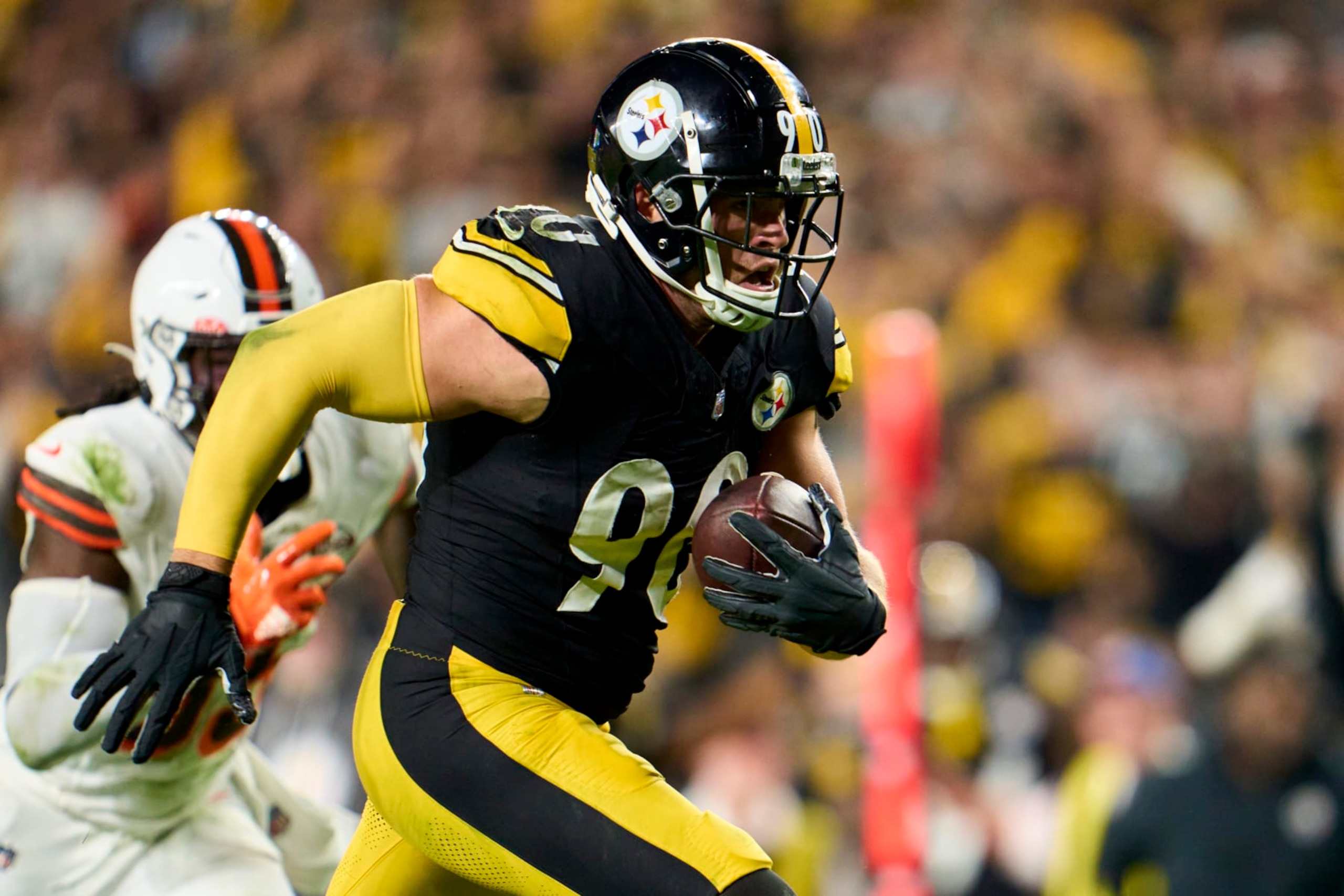 PITTSBURGH, PA - SEPTEMBER 18: T.J. Watt #90 of the Pittsburgh Steelers scores a touchdown against the Cleveland Browns during the second half at Acrisure Stadium on September 18, 2023 in Pittsburgh, Pennsylvania. (Photo by Cooper Neill/Getty Images)