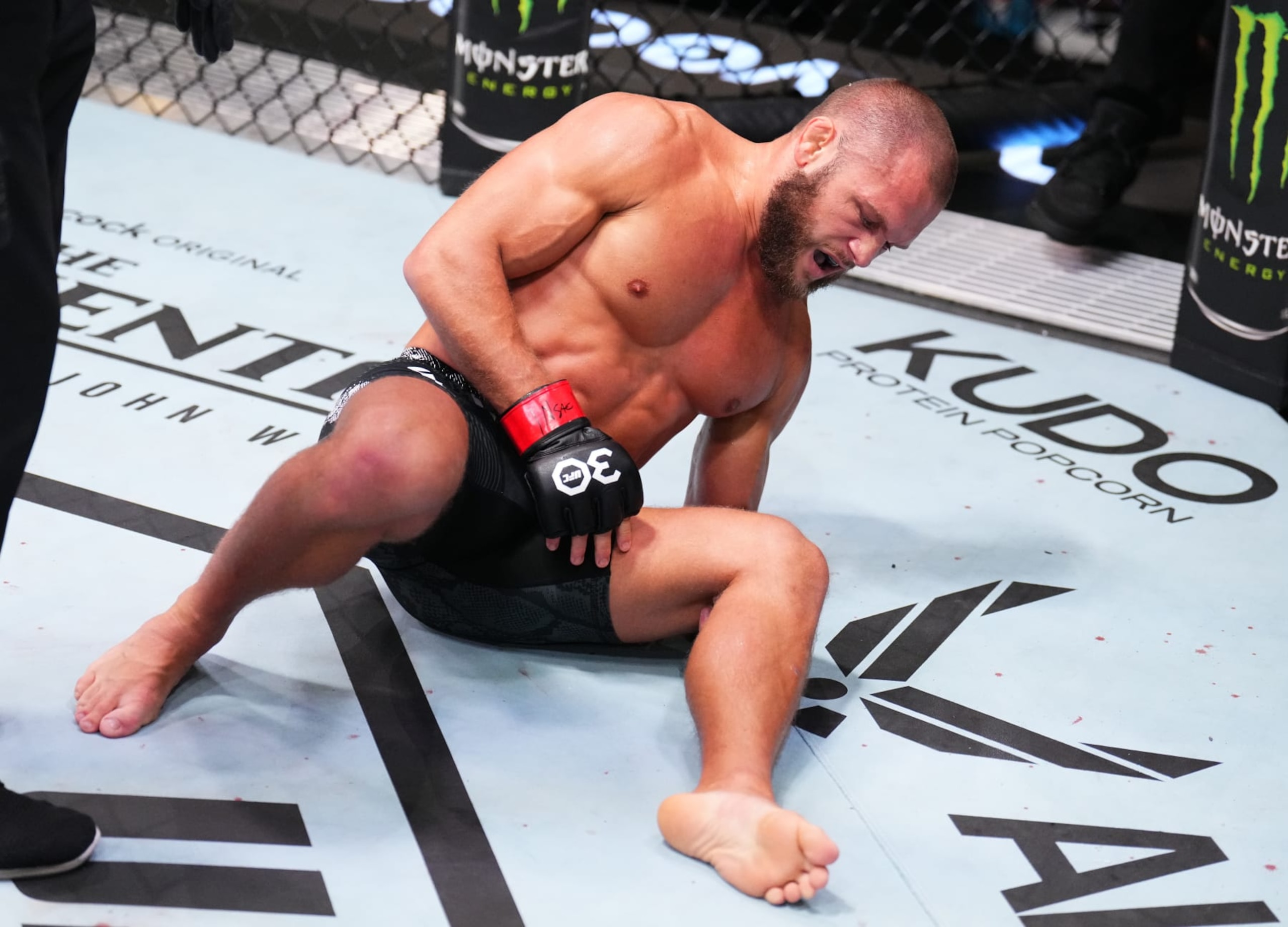 LAS VEGAS, NEVADA - SEPTEMBER 23: Rafael Fiziev of Kazakstan reacts after suffering a knee injury against Mateusz Gamrot of Poland in a lightweight fight during the UFC Fight Night event at UFC APEX on September 23, 2023 in Las Vegas, Nevada. (Photo by Chris Unger/Zuffa LLC via Getty Images)