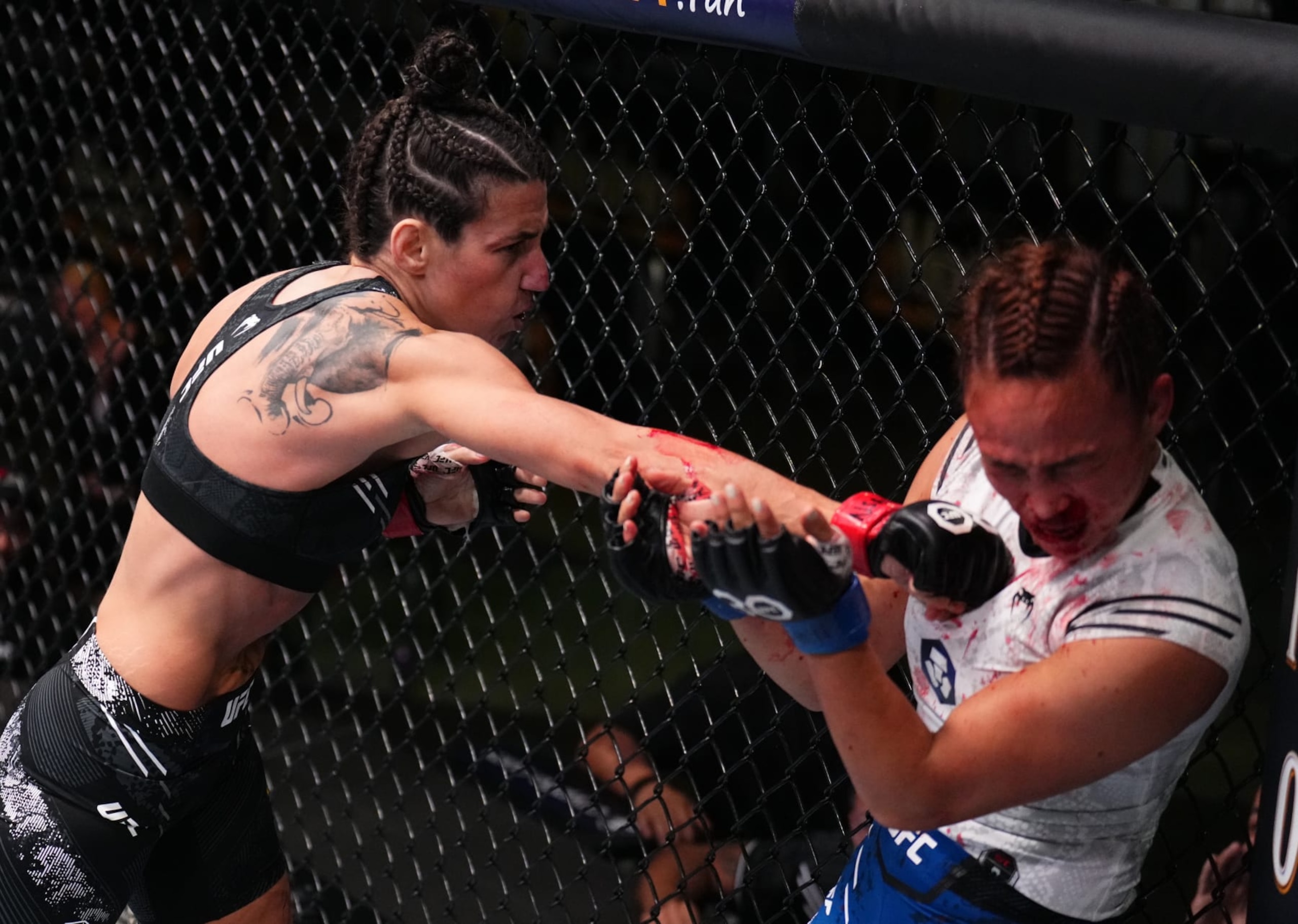 LAS VEGAS, NEVADA - SEPTEMBER 23: (L-R) Marina Rodriguez of Brazil punches Michelle Waterson-Gomez in a strawweight fight during the UFC Fight Night event at UFC APEX on September 23, 2023 in Las Vegas, Nevada. (Photo by Chris Unger/Zuffa LLC via Getty Images)
