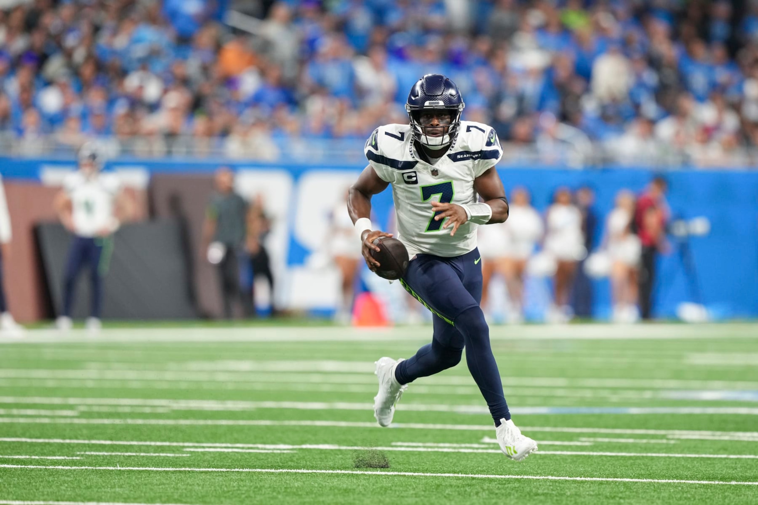 DETROIT, MI - SEPTEMBER 17: Quarterback Geno Smith #7 of the Seattle Seahawks runs the ball during the second half of an NFL football game against the Detroit Lions at Ford Field on September 17, 2023 in Detroit, Michigan. (Photo by Todd Rosenberg/Getty Images) DETROIT, MI - SEPTEMBER 17: Quarterback Geno Smith #7 of the Seattle Seahawks runs the ball during the second half of an NFL football game against the Detroit Lions at Ford Field on September 17, 2023 in Detroit, Michigan. (Photo by Todd Rosenberg/Getty Images)