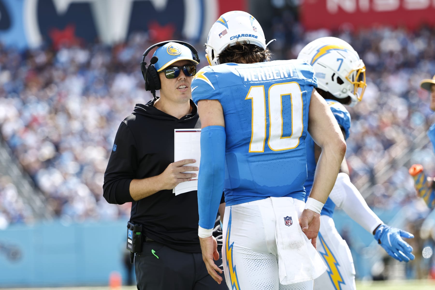 Chargers offensive coordinator Kellen Moore (left) and quarterback Justin Herbert (right)
