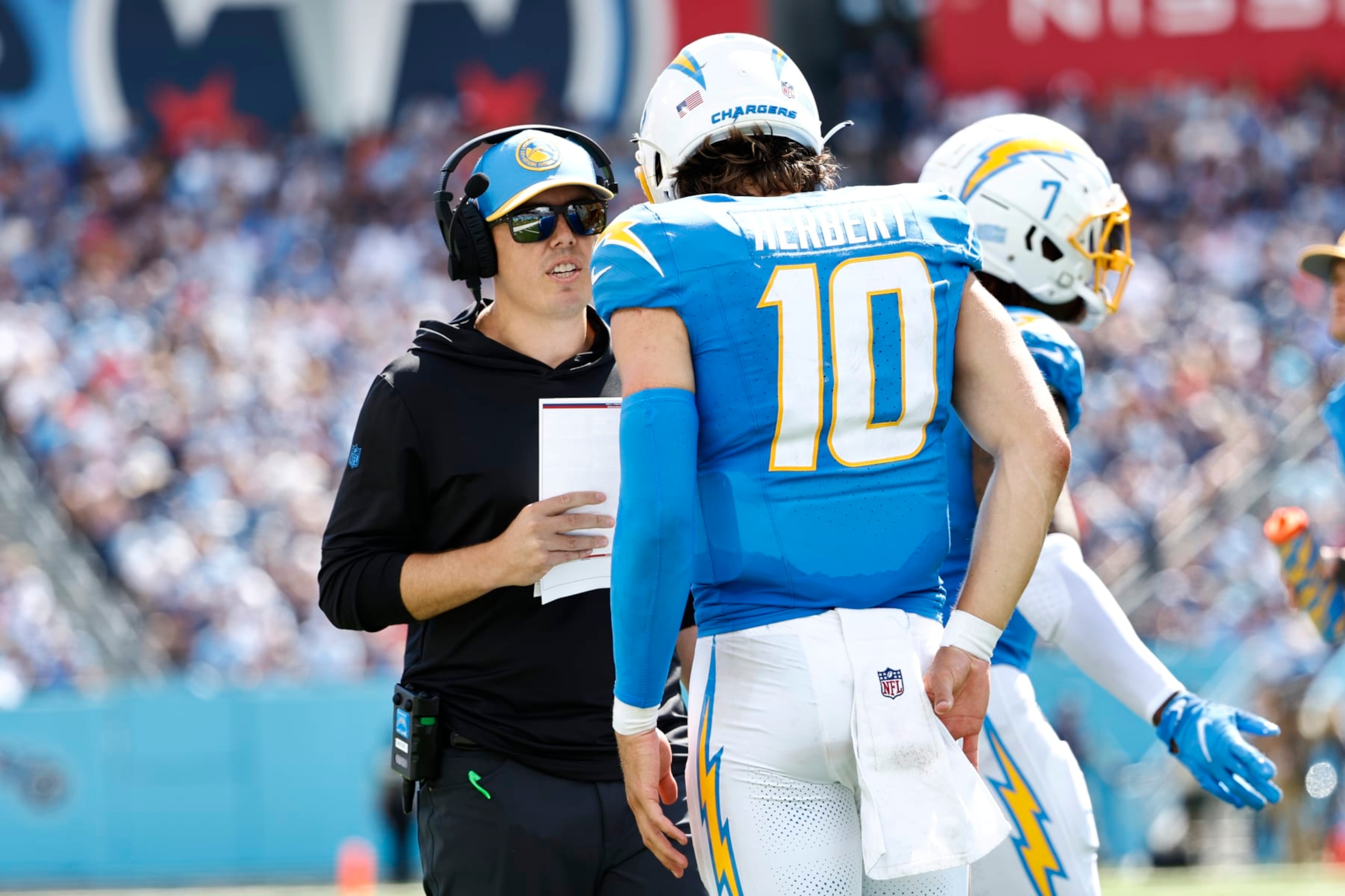 Chargers offensive coordinator Kellen Moore (left) and quarterback Justin Herbert (right)