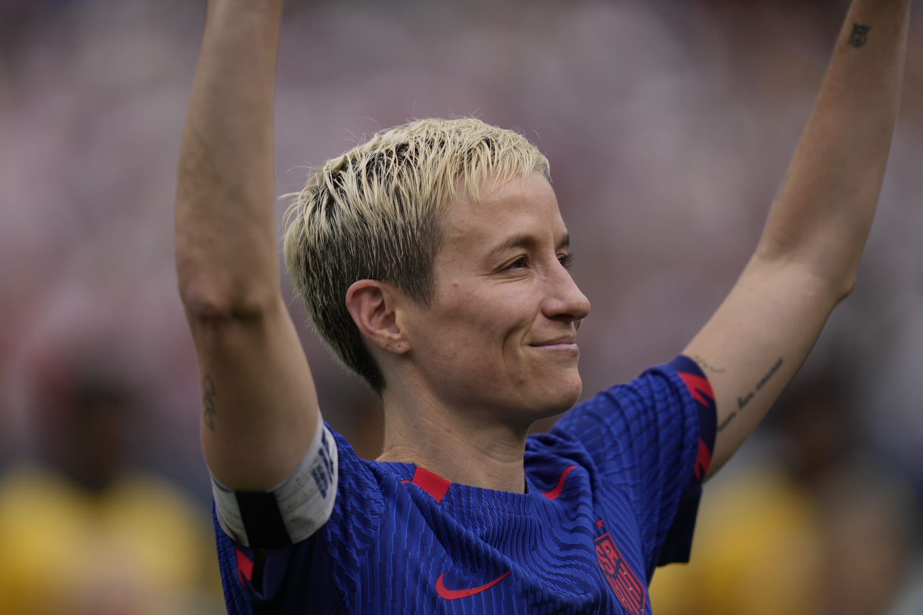 United States forward Megan Rapinoe waves to fans during a retirement ceremony before a soccer game against South Africa, Sunday, Sept. 24, 2023, in Chicago. (AP Photo/Erin Hooley)