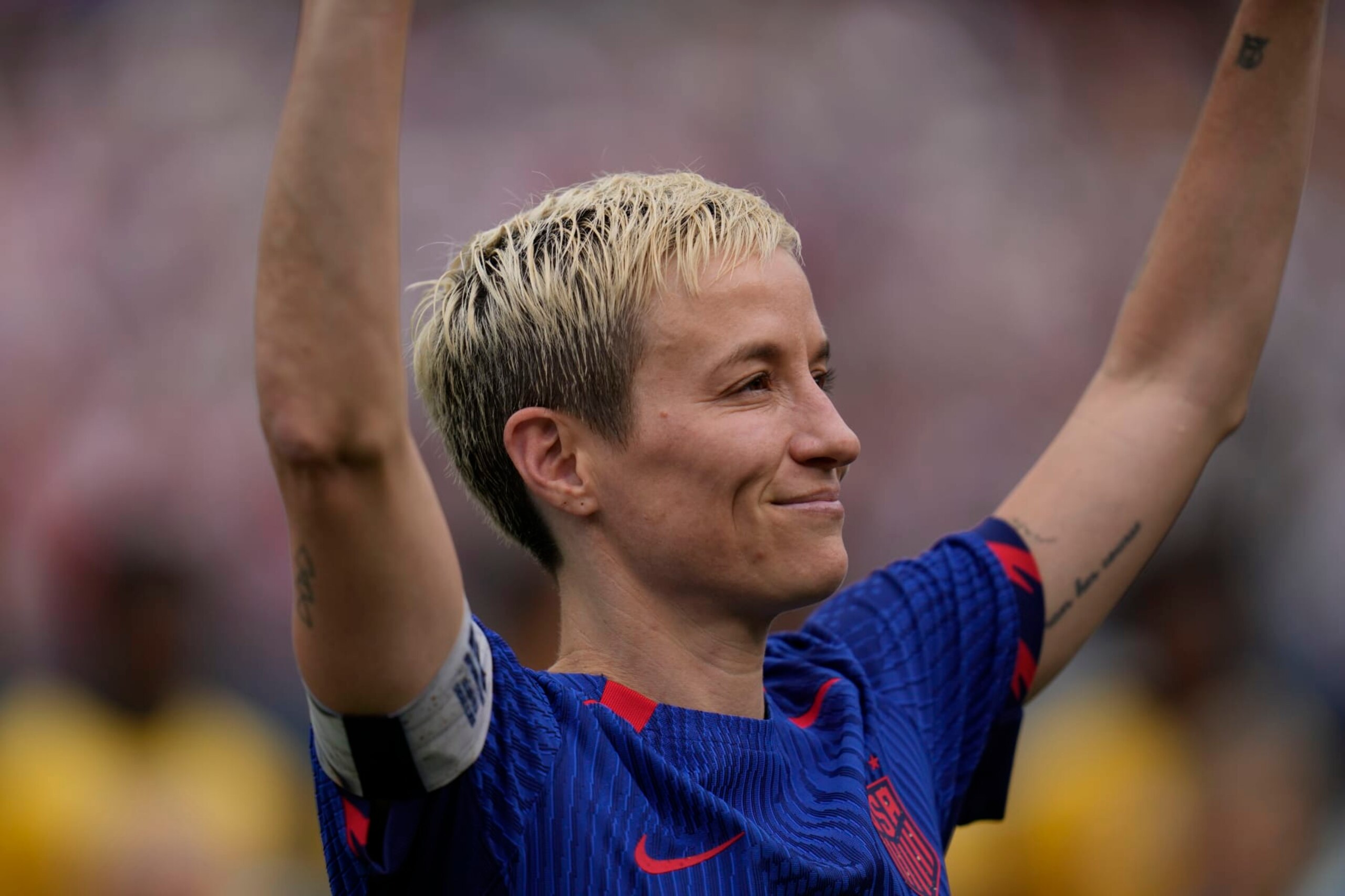 United States forward Megan Rapinoe waves to fans during a retirement ceremony before a soccer game against South Africa, Sunday, Sept. 24, 2023, in Chicago. (AP Photo/Erin Hooley)