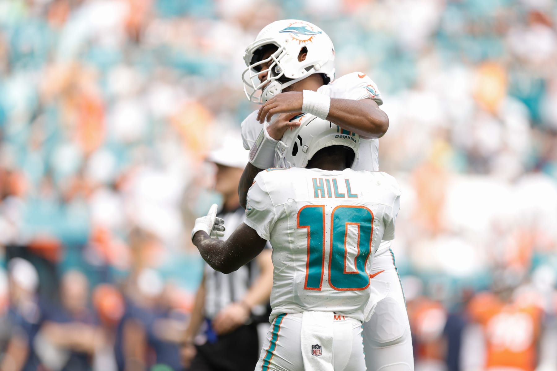 MIAMI GARDENS, FLORIDA - SEPTEMBER 24: Tua Tagovailoa #1 of the Miami Dolphins and Tyreek Hill #10 of the Miami Dolphins celebrate after a Miami touchdown during the third quarter against the Denver Broncos at Hard Rock Stadium on September 24, 2023 in Miami Gardens, Florida. (Photo by Carmen Mandato/Getty Images)