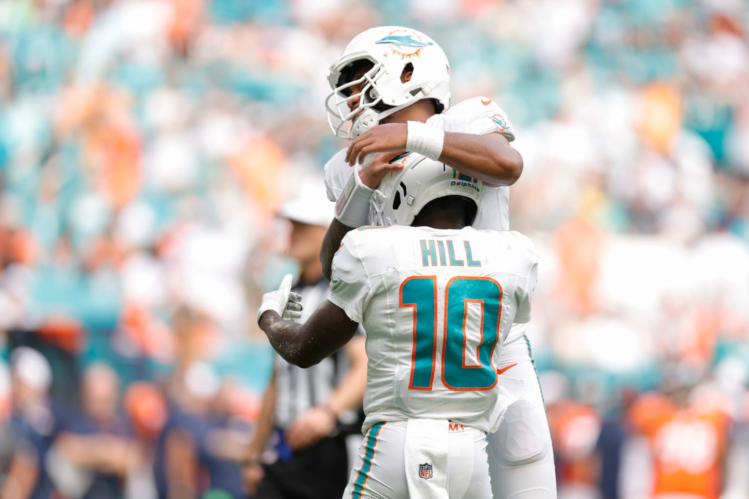 MIAMI GARDENS, FLORIDA - SEPTEMBER 24: Tua Tagovailoa #1 of the Miami Dolphins and Tyreek Hill #10 of the Miami Dolphins celebrate after a Miami touchdown during the third quarter against the Denver Broncos at Hard Rock Stadium on September 24, 2023 in Miami Gardens, Florida. (Photo by Carmen Mandato/Getty Images)