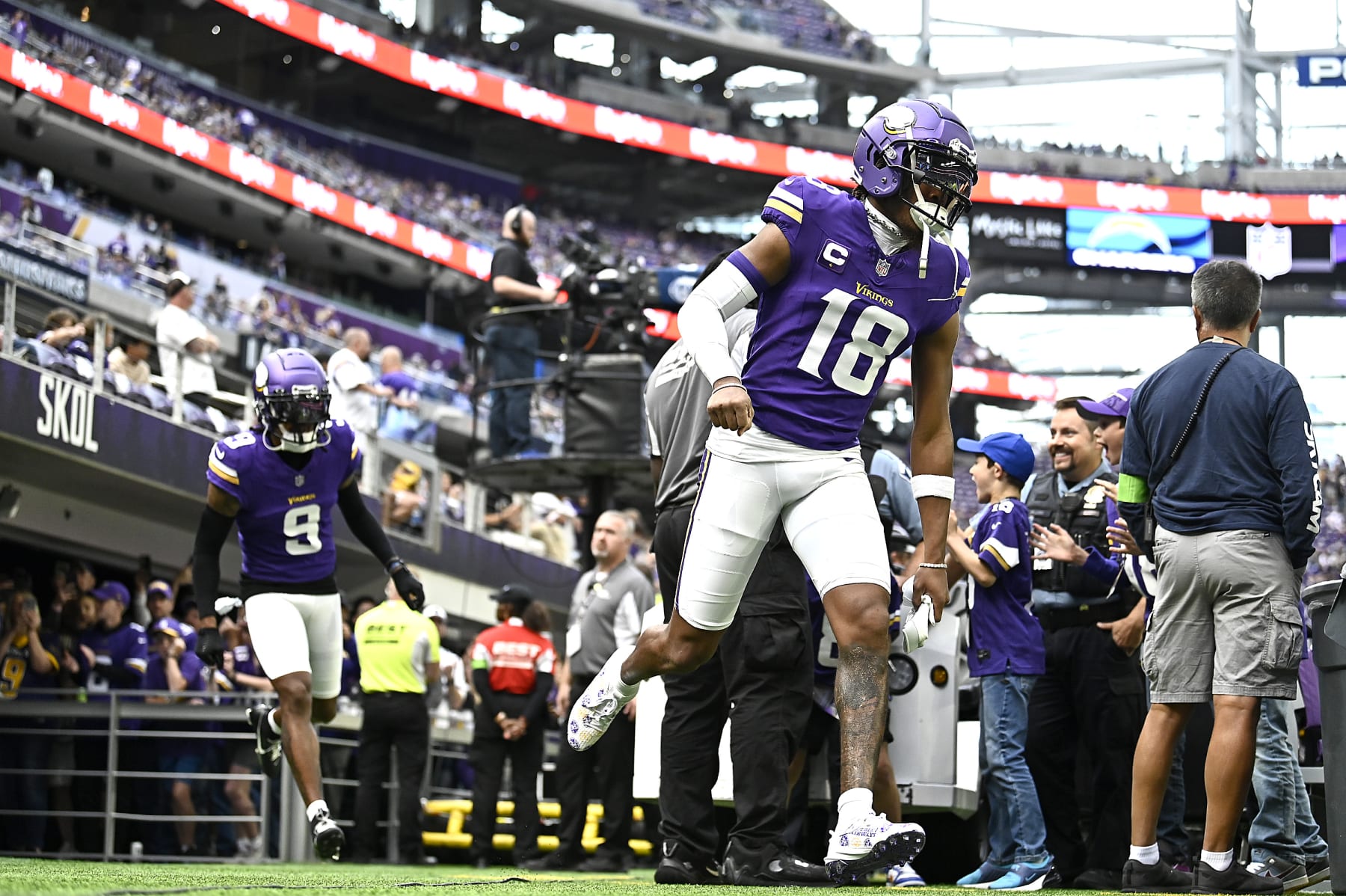 MINNEAPOLIS, MINNESOTA - SEPTEMBER 24: Justin Jefferson #18 of the Minnesota Vikings runs onto the field prior to a game against the Los Angeles Chargers at U.S. Bank Stadium on September 24, 2023 in Minneapolis, Minnesota. (Photo by Stephen Maturen/Getty Images)