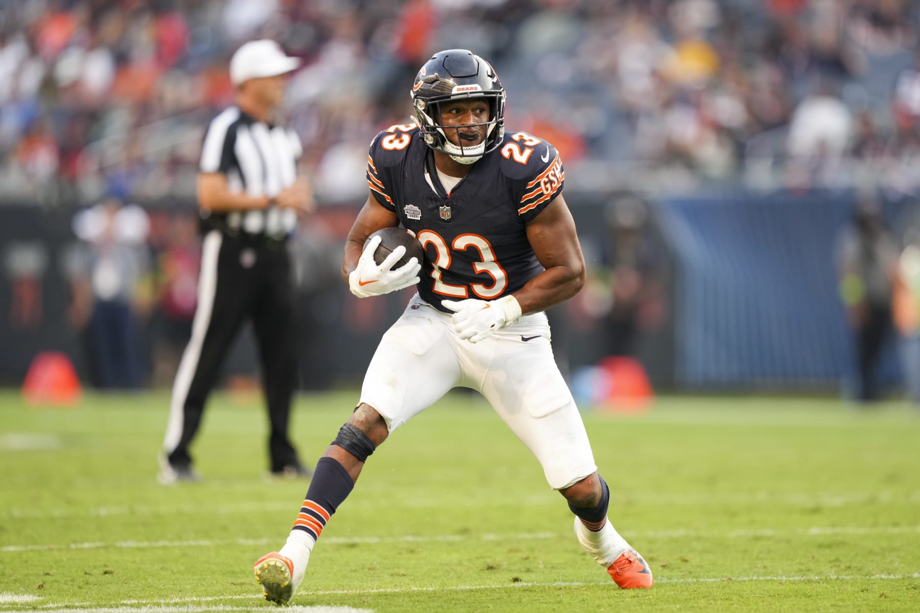 CHICAGO, IL - SEPTEMBER 10: Running back Roschon Johnson #23 of the Chicago Bears runs the ball during an NFL football game against the Green Bay Packers at Soldier Field on September 10, 2023 in Chicago, Illinois. (Photo by Todd Rosenberg/Getty Images)
