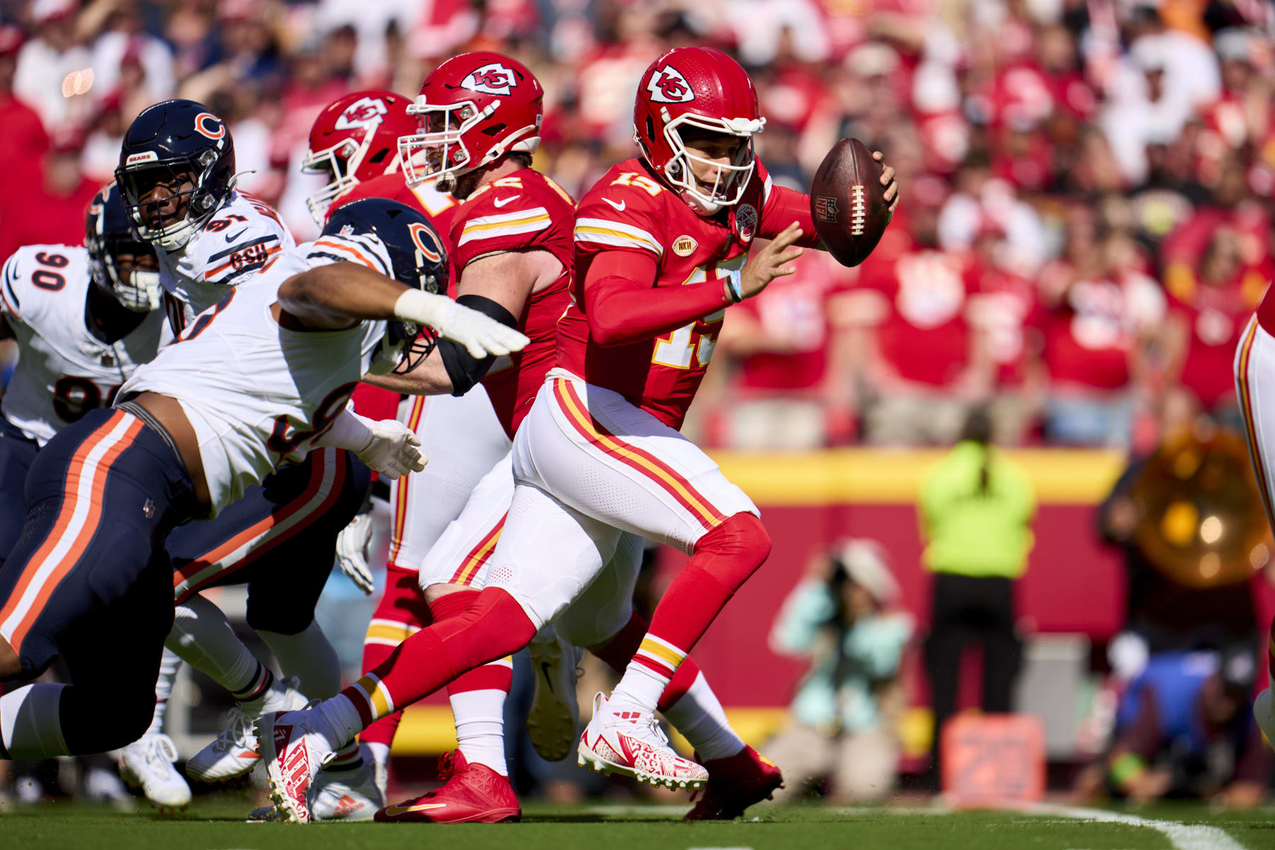 KANSAS CITY, MO - SEPTEMBER 24: Patrick Mahomes #15 of the Kansas City Chiefs scrambles against the Chicago Bears during the first half at GEHA Field at Arrowhead Stadium on September 24, 2023 in Kansas City, Missouri. (Photo by Cooper Neill/Getty Images)