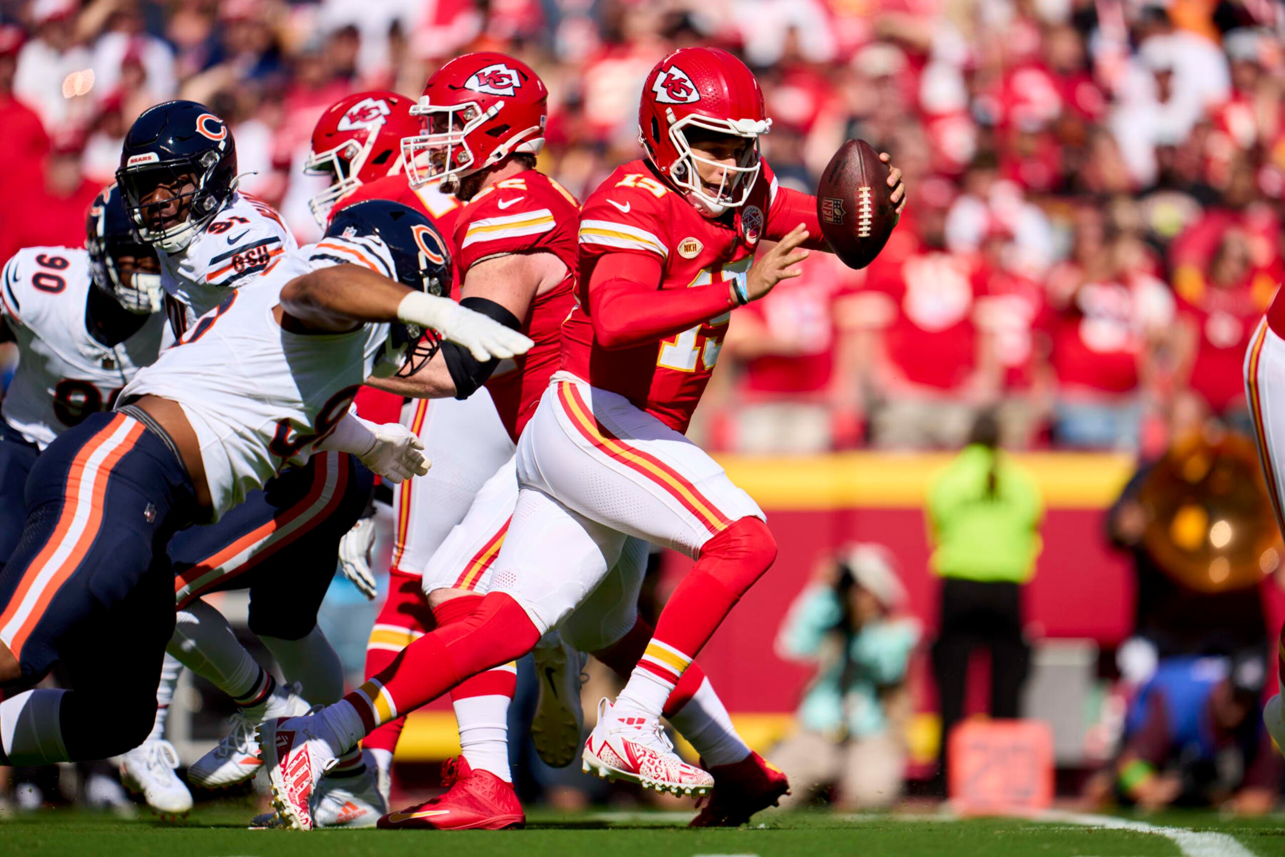 KANSAS CITY, MO - SEPTEMBER 24: Patrick Mahomes #15 of the Kansas City Chiefs scrambles against the Chicago Bears during the first half at GEHA Field at Arrowhead Stadium on September 24, 2023 in Kansas City, Missouri. (Photo by Cooper Neill/Getty Images)