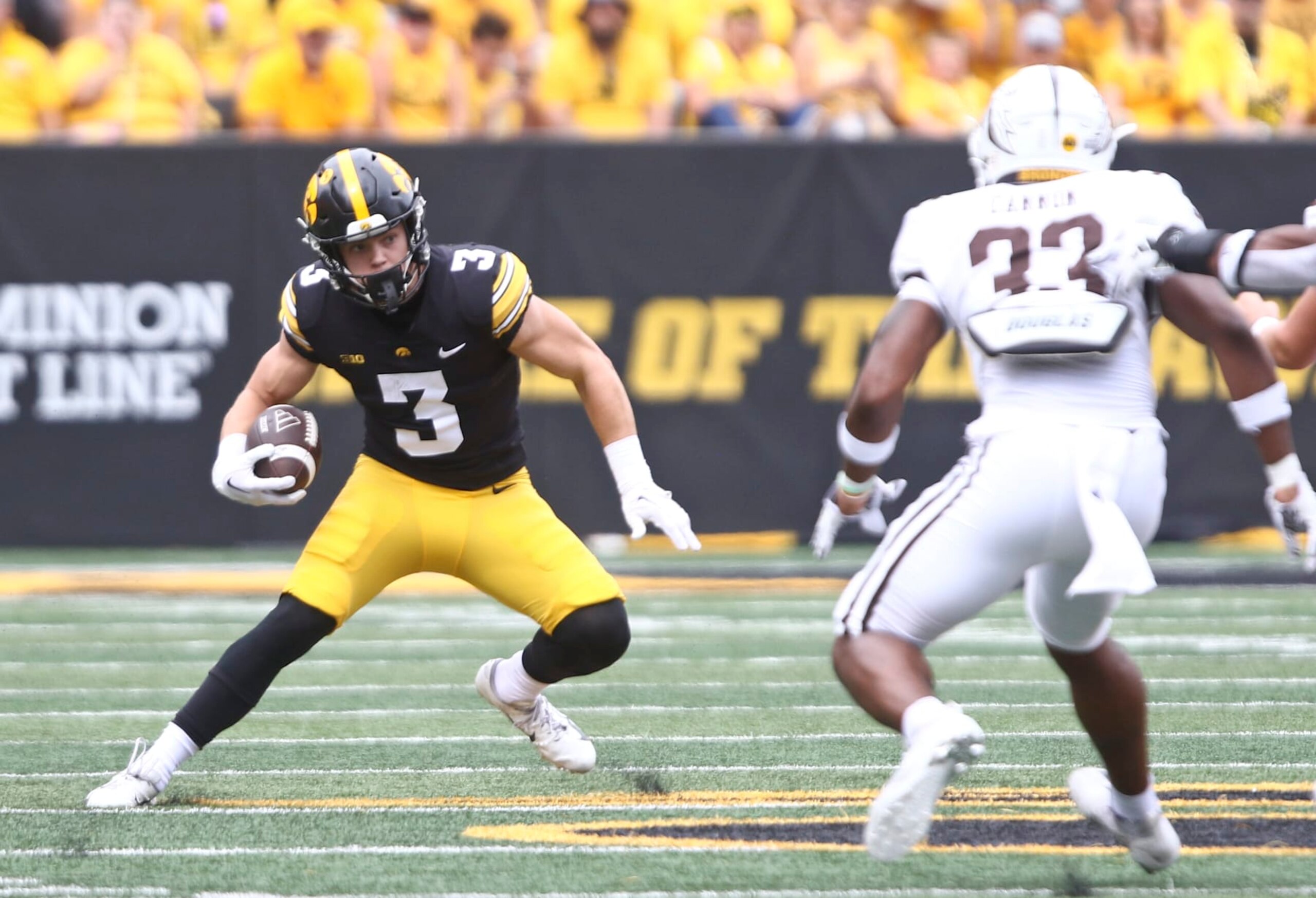 IOWA CITY, IOWA- SEPTEMBER 16:  Defensive back Cooper DeJean #3 of the Iowa Hawkeyes runs back a kick during the first half in front of linebacker Quinton Cannon #33 of the Western Michigan Broncos at Kinnick Stadium on September 16, 2023 in Iowa City, Iowa.  (Photo by Matthew Holst/Getty Images)