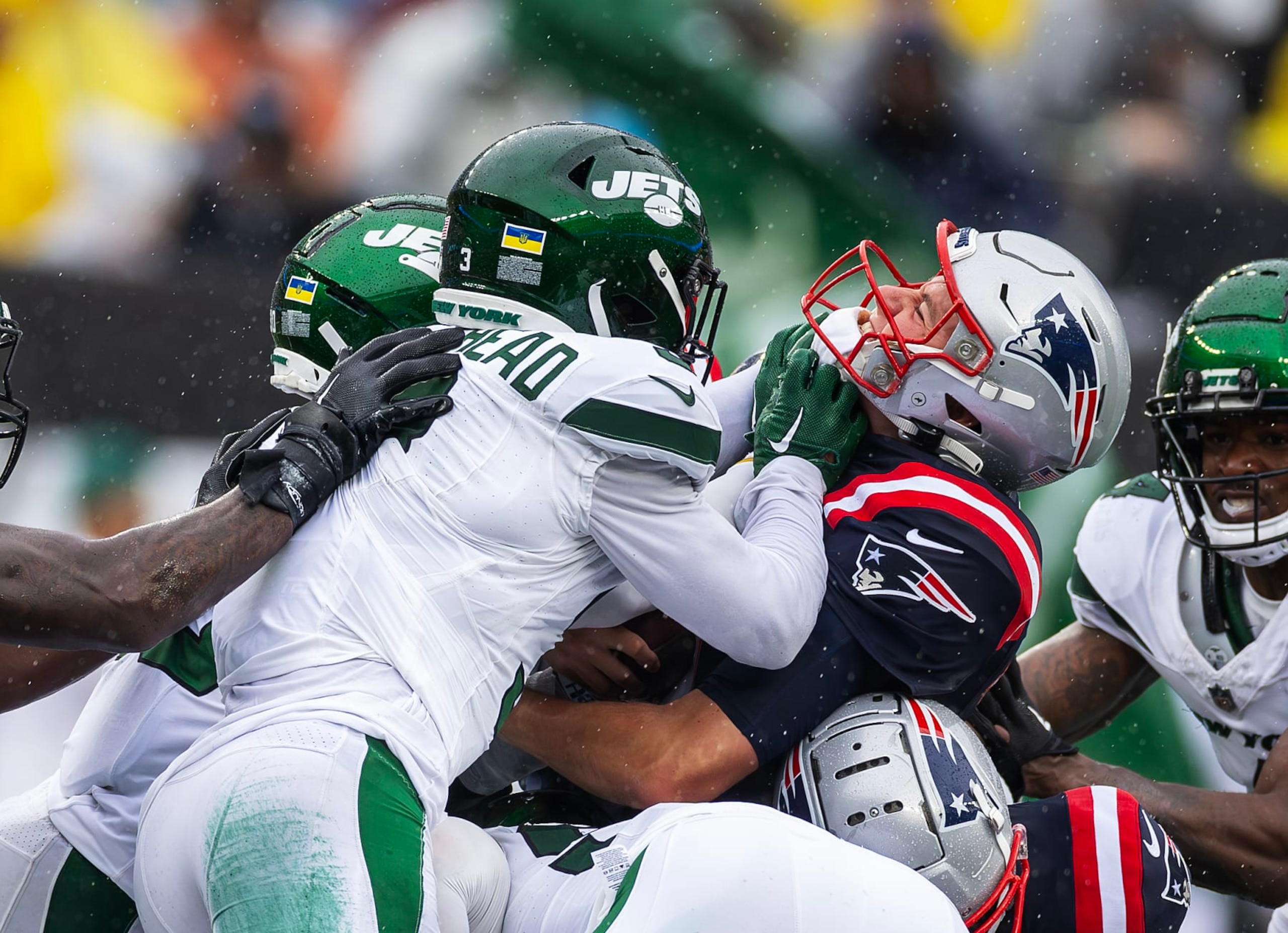 EAST RUTHERFORD, NEW JERSEY - SEPTEMBER 24: Mac Jones #10 of the New England Patriots attempts a quarterback sneak in the second half as Jordan Whitehead #3 of the New York Jets makes the tackle at MetLife Stadium on September 24, 2023 in East Rutherford, New Jersey. (Photo by Al Bello/Getty Images) EAST RUTHERFORD, NEW JERSEY - SEPTEMBER 24: Mac Jones #10 of the New England Patriots attempts a quarterback sneak in the second half as Jordan Whitehead #3 of the New York Jets makes the tackle at MetLife Stadium on September 24, 2023 in East Rutherford, New Jersey. (Photo by Al Bello/Getty Images)