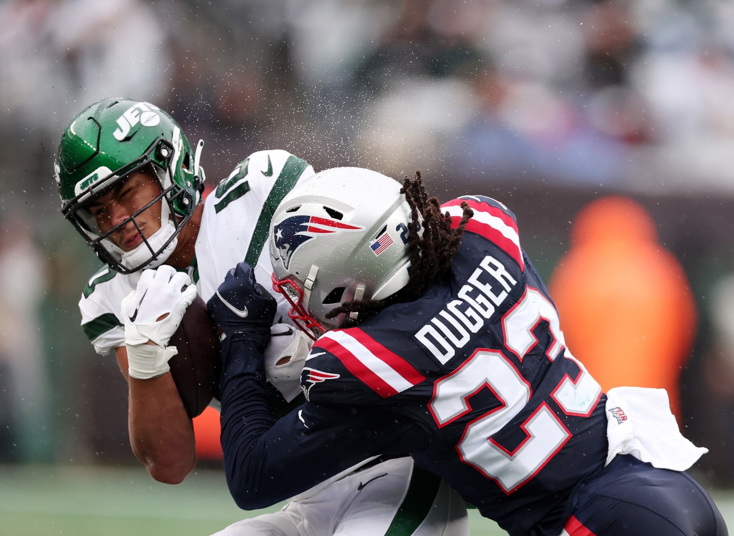 EAST RUTHERFORD, NEW JERSEY - SEPTEMBER 24: Allen Lazard #10 of the New York Jets is tackled by Kyle Dugger #23 of the New England Patriots at MetLife Stadium on September 24, 2023 in East Rutherford, New Jersey. (Photo by Al Bello/Getty Images) EAST RUTHERFORD, NEW JERSEY - SEPTEMBER 24: Allen Lazard #10 of the New York Jets is tackled by Kyle Dugger #23 of the New England Patriots at MetLife Stadium on September 24, 2023 in East Rutherford, New Jersey. (Photo by Al Bello/Getty Images)