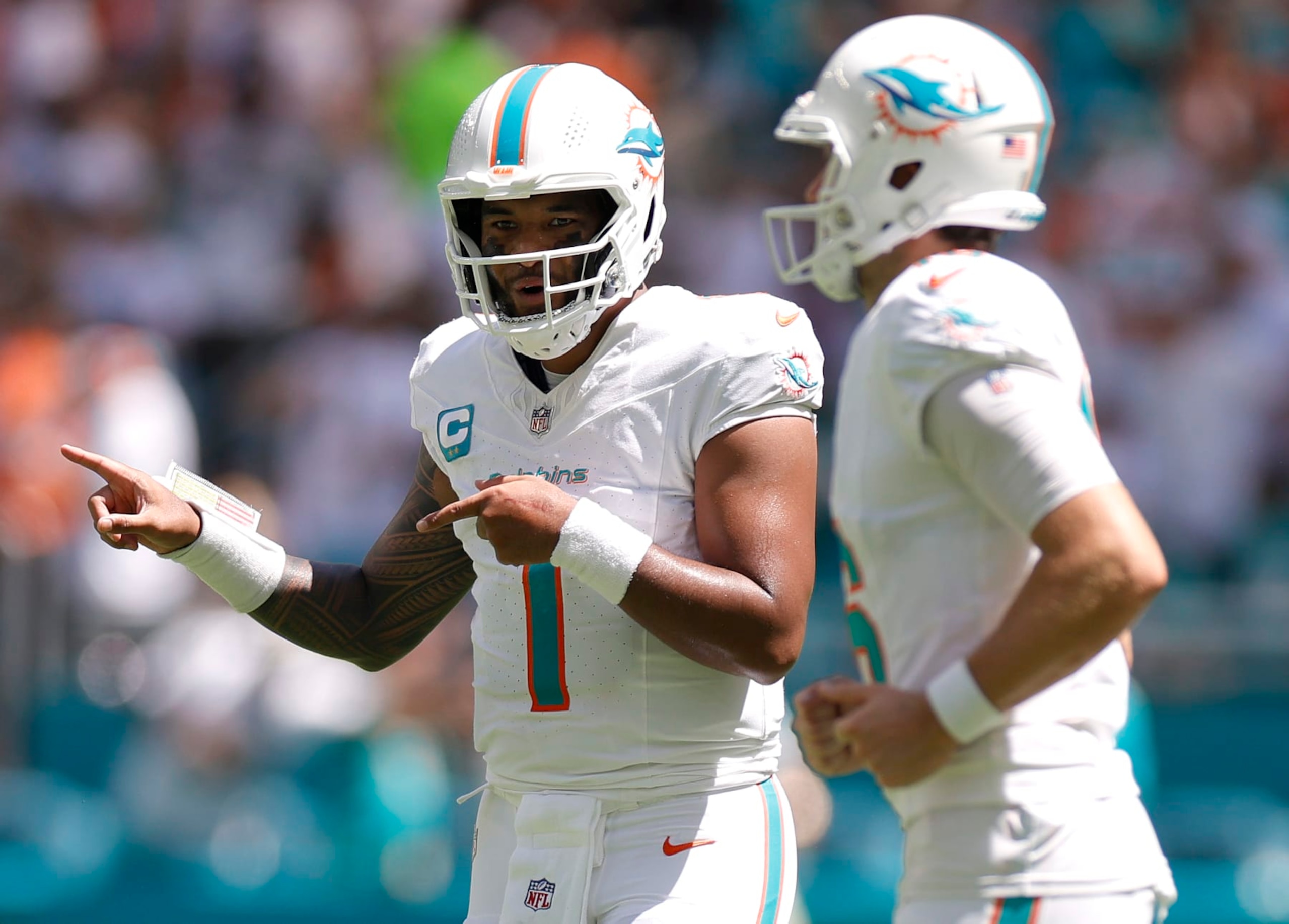 MIAMI GARDENS, FLORIDA - SEPTEMBER 24: Tua Tagovailoa #1 of the Miami Dolphins celebrates after his touchdown pass during the second quarter against the Denver Broncos at Hard Rock Stadium on September 24, 2023 in Miami Gardens, Florida. (Photo by Carmen Mandato/Getty Images) MIAMI GARDENS, FLORIDA - SEPTEMBER 24: Tua Tagovailoa #1 of the Miami Dolphins celebrates after his touchdown pass during the second quarter against the Denver Broncos at Hard Rock Stadium on September 24, 2023 in Miami Gardens, Florida. (Photo by Carmen Mandato/Getty Images)
