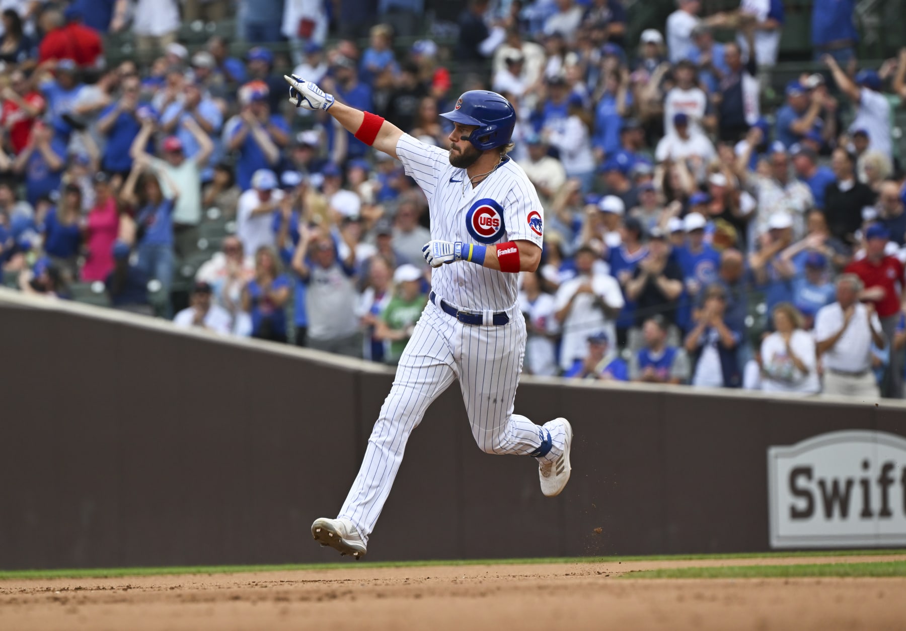 CHICAGO, ILLINOIS - SEPTEMBER 24: Patrick Wisdom #16 of the Chicago Cubs celebrates a two-run home run during the sixth inning against the Colorado Rockies at Wrigley Field on September 24, 2023 in Chicago, Illinois. The Cubs defeated the Rockies 4-3.  (Photo by Nuccio DiNuzzo/Getty Images)