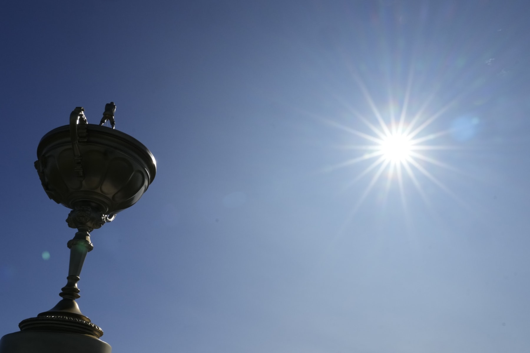 Sun shines over a replica of the Ryder Cup trophy at the Marco Simone Golf Club in Guidonia Montecelio, Monday, Sept. 25, 2023. The Marco Simone Club on the outskirts of Rome will host the 44th edition of The Ryder Cup, the biennial competition between Europe and the United States headed to Italy for the first time. (AP Photo/Gregorio Borgia)