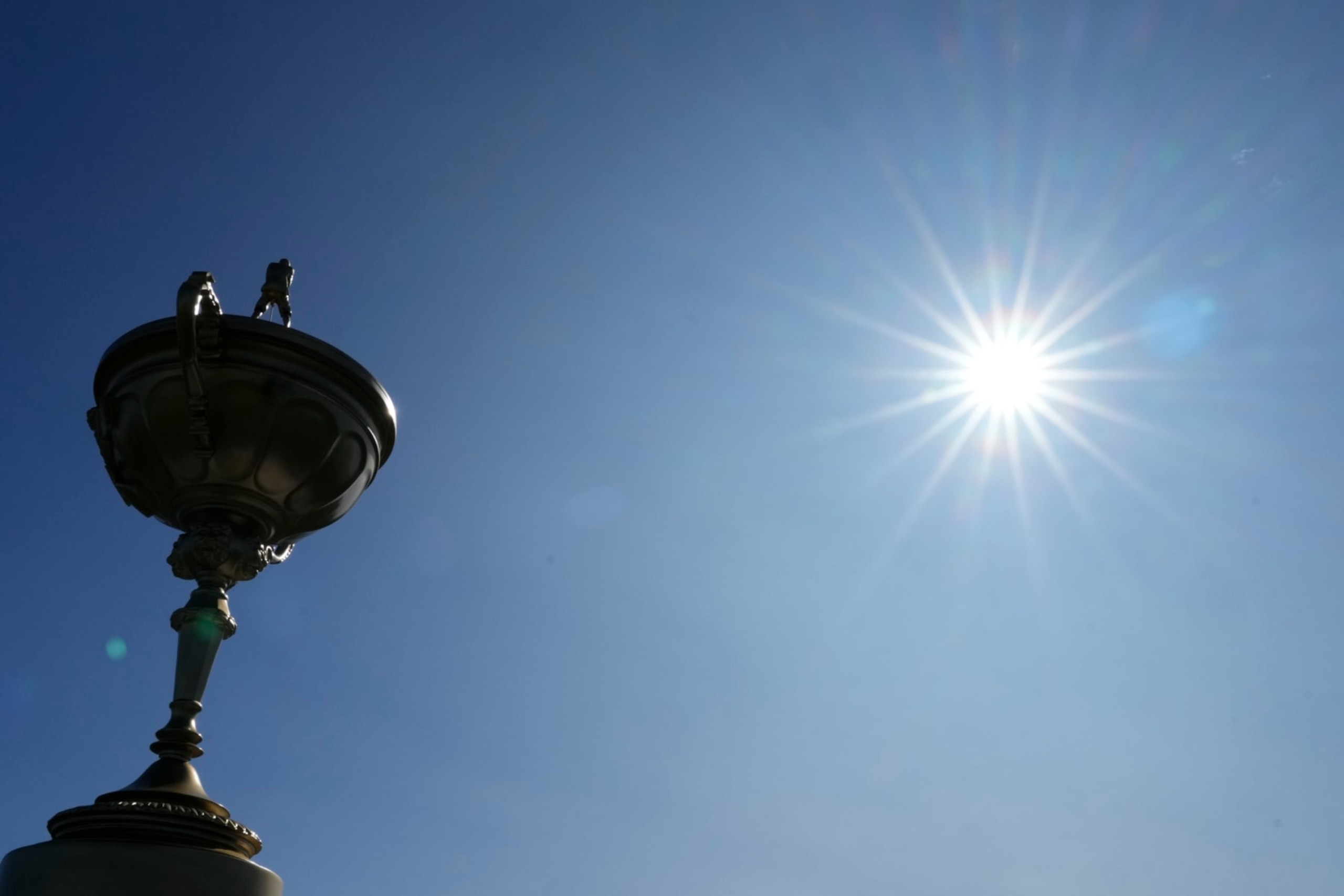 Sun shines over a replica of the Ryder Cup trophy at the Marco Simone Golf Club in Guidonia Montecelio, Monday, Sept. 25, 2023. The Marco Simone Club on the outskirts of Rome will host the 44th edition of The Ryder Cup, the biennial competition between Europe and the United States headed to Italy for the first time. (AP Photo/Gregorio Borgia)