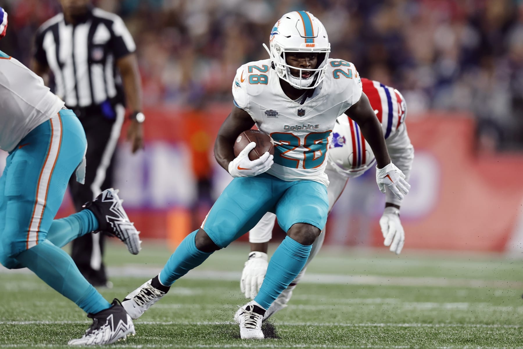 Miami Dolphins running back De'Von Achane (28) plays against the New England Patriots during an NFL football game, Sunday, Sept. 17, 2023, in Foxborough, Mass. (AP Photo/Michael Dwyer)