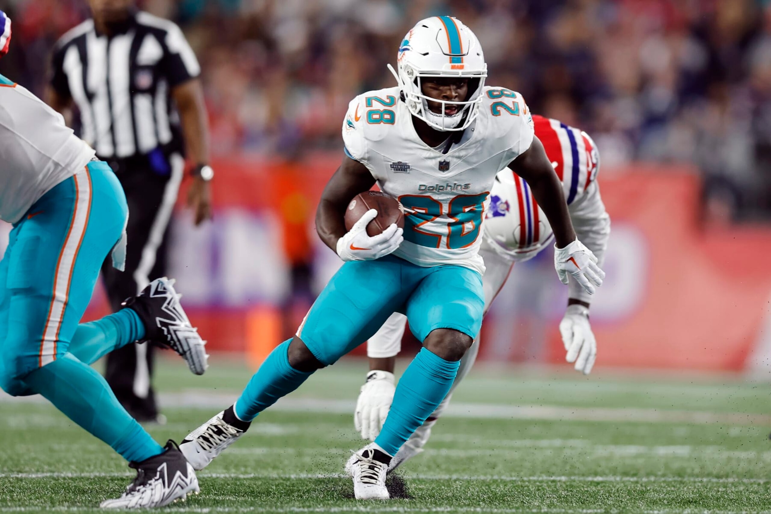 Miami Dolphins running back De'Von Achane (28) plays against the New England Patriots during an NFL football game, Sunday, Sept. 17, 2023, in Foxborough, Mass. (AP Photo/Michael Dwyer)