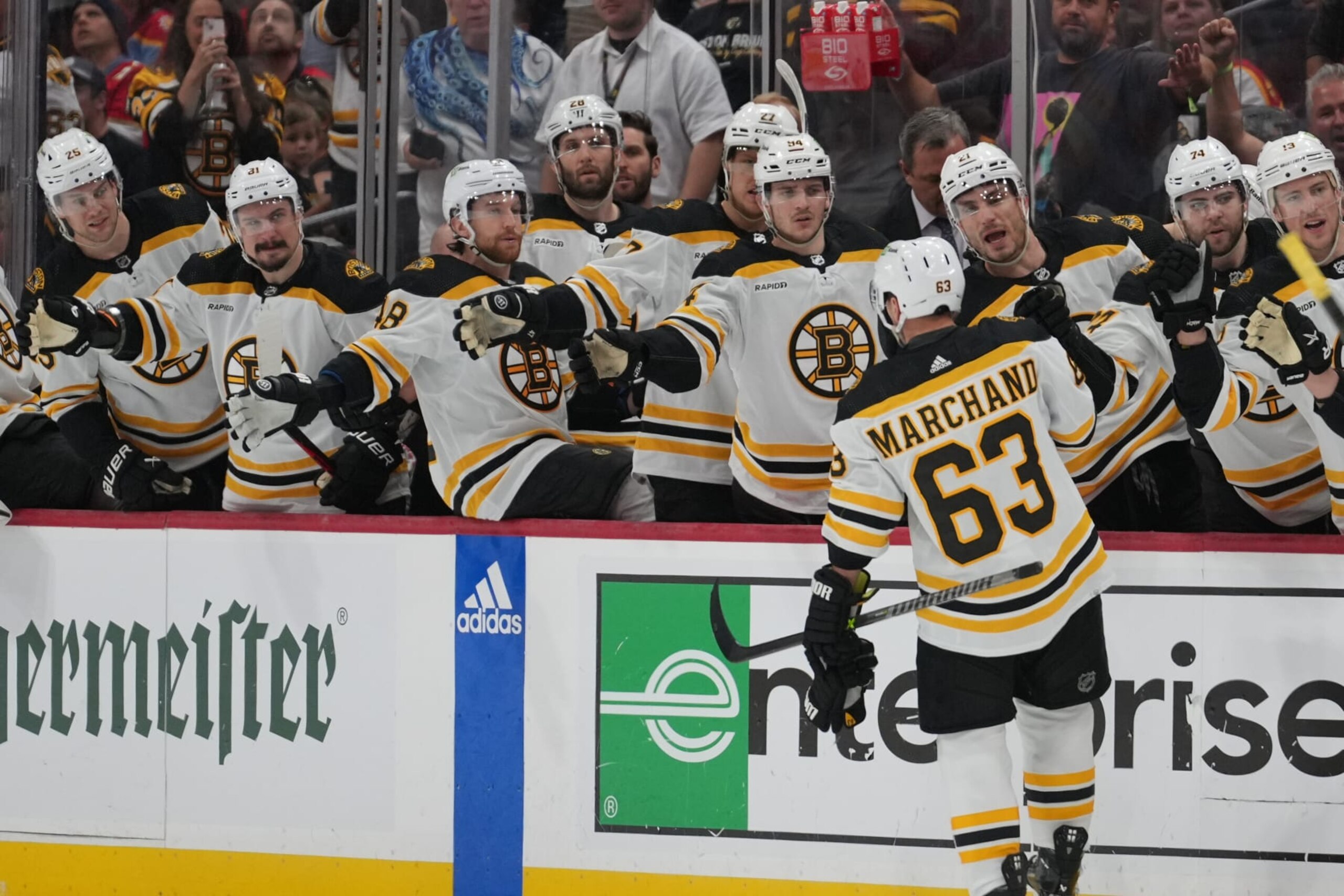 SUNRISE, FL - APRIL 23: Boston Bruins left wing Brad Marchand (63) gets fist bumps from teammates after a questionable goal in the first period during game four of  the first round of the Eastern Conference Playoffs between the Boston Bruins and the Florida Panthers on Friday, April 23, 2023 at FLA Live Arena in Sunrise, Fla  (Photo by Peter Joneleit/Icon Sportswire via Getty Images)