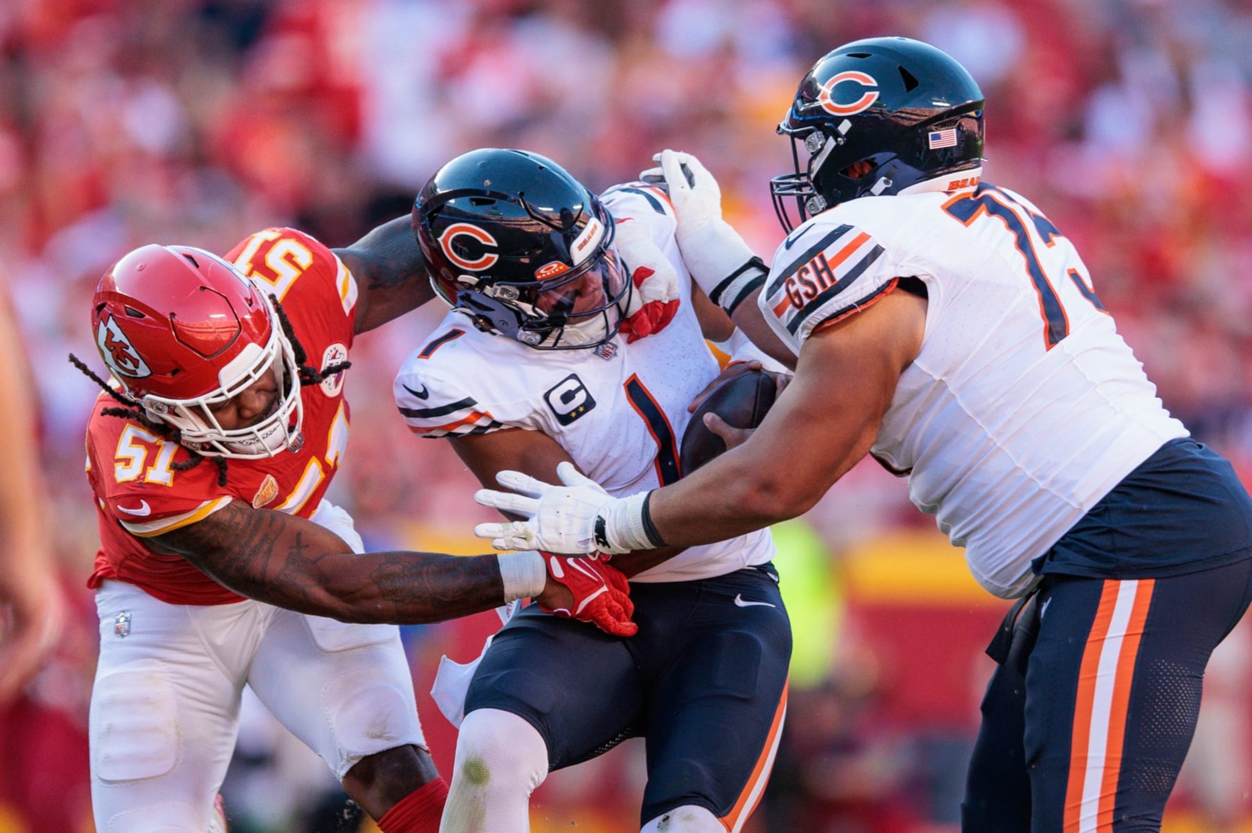 KANSAS CITY, MO - SEPTEMBER 24: Chicago Bears quarterback Justin Fields (1) is caught between Kansas City Chiefs defensive end Mike Danna (51) and Chicago Bears offensive tackle Larry Borom (75) during the second half on September 24th, 2023 at GEHA Field at Arrowhead Stadium in Kansas City, Missouri. (Photo by William Purnell/Icon Sportswire via Getty Images) KANSAS CITY, MO - SEPTEMBER 24: Chicago Bears quarterback Justin Fields (1) is caught between Kansas City Chiefs defensive end Mike Danna (51) and Chicago Bears offensive tackle Larry Borom (75) during the second half on September 24th, 2023 at GEHA Field at Arrowhead Stadium in Kansas City, Missouri. (Photo by William Purnell/Icon Sportswire via Getty Images)