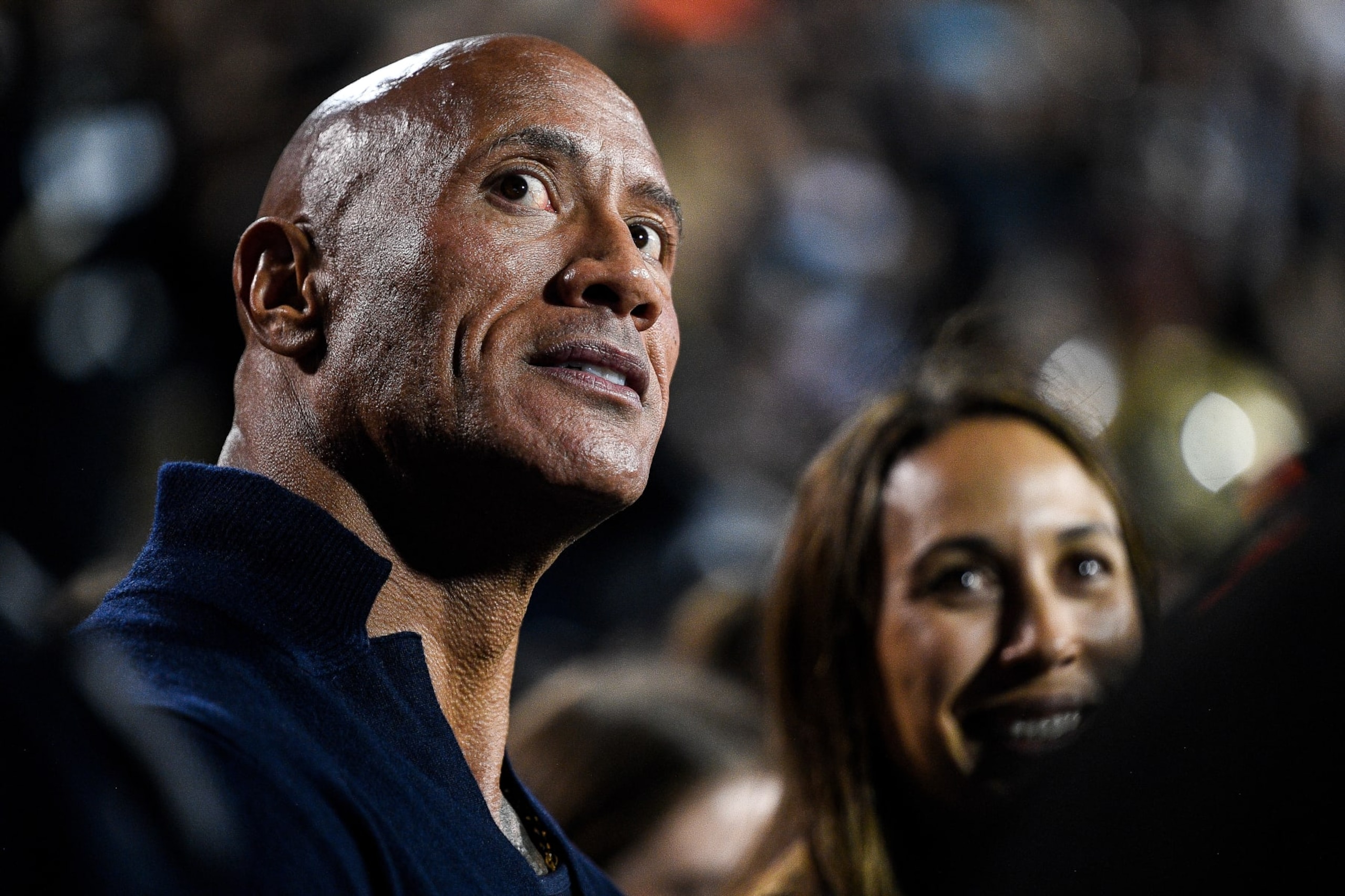 BOULDER, CO - SEPTEMBER 16: Dwayne The Rock Johnson stands on the sideline in the first half of a game between the Colorado Buffaloes and the Colorado State Rams at Folsom Field on September 16, 2023 in Boulder, Colorado. (Photo by Dustin Bradford/Getty Images) BOULDER, CO - SEPTEMBER 16: Dwayne The Rock Johnson stands on the sideline in the first half of a game between the Colorado Buffaloes and the Colorado State Rams at Folsom Field on September 16, 2023 in Boulder, Colorado. (Photo by Dustin Bradford/Getty Images)